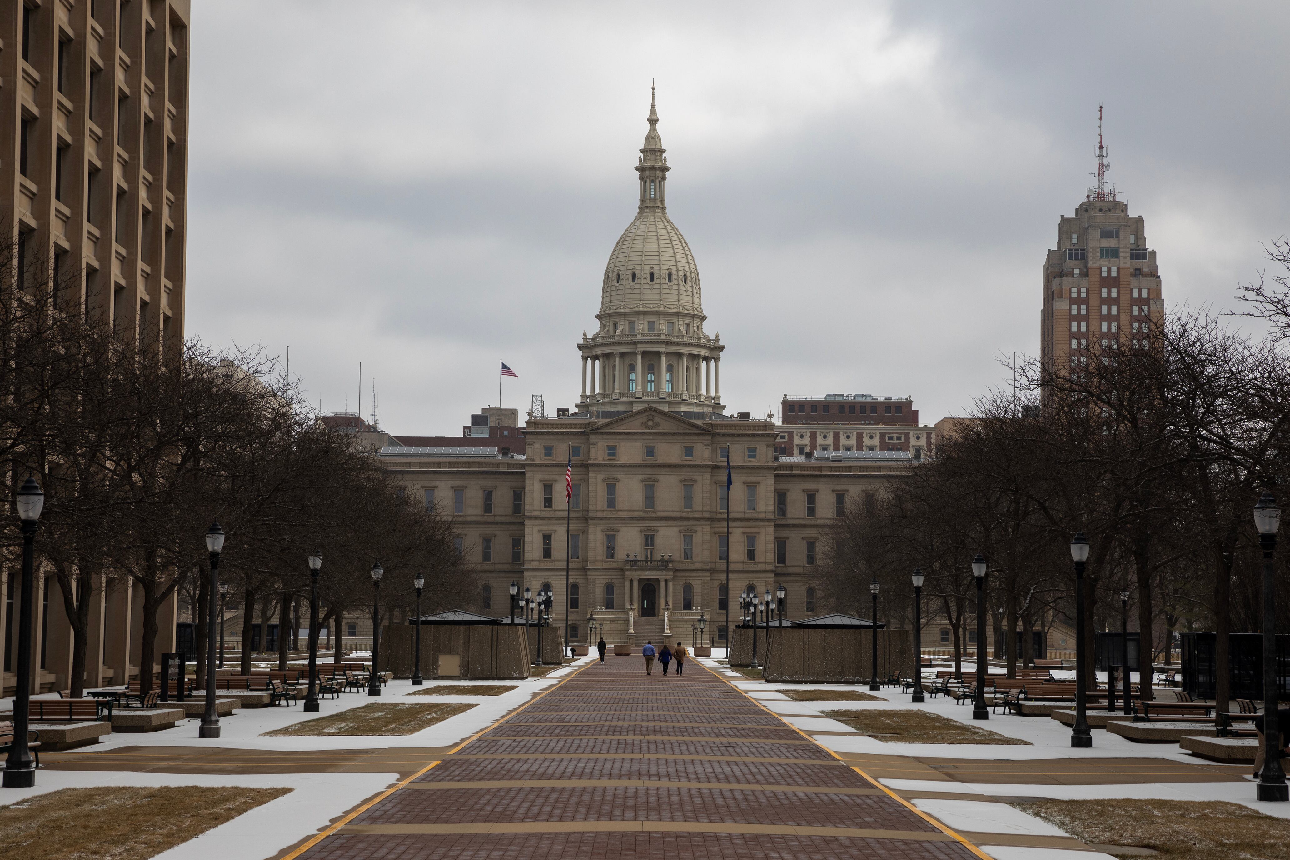 A large stone Capitol building on a cold, cloudy day.