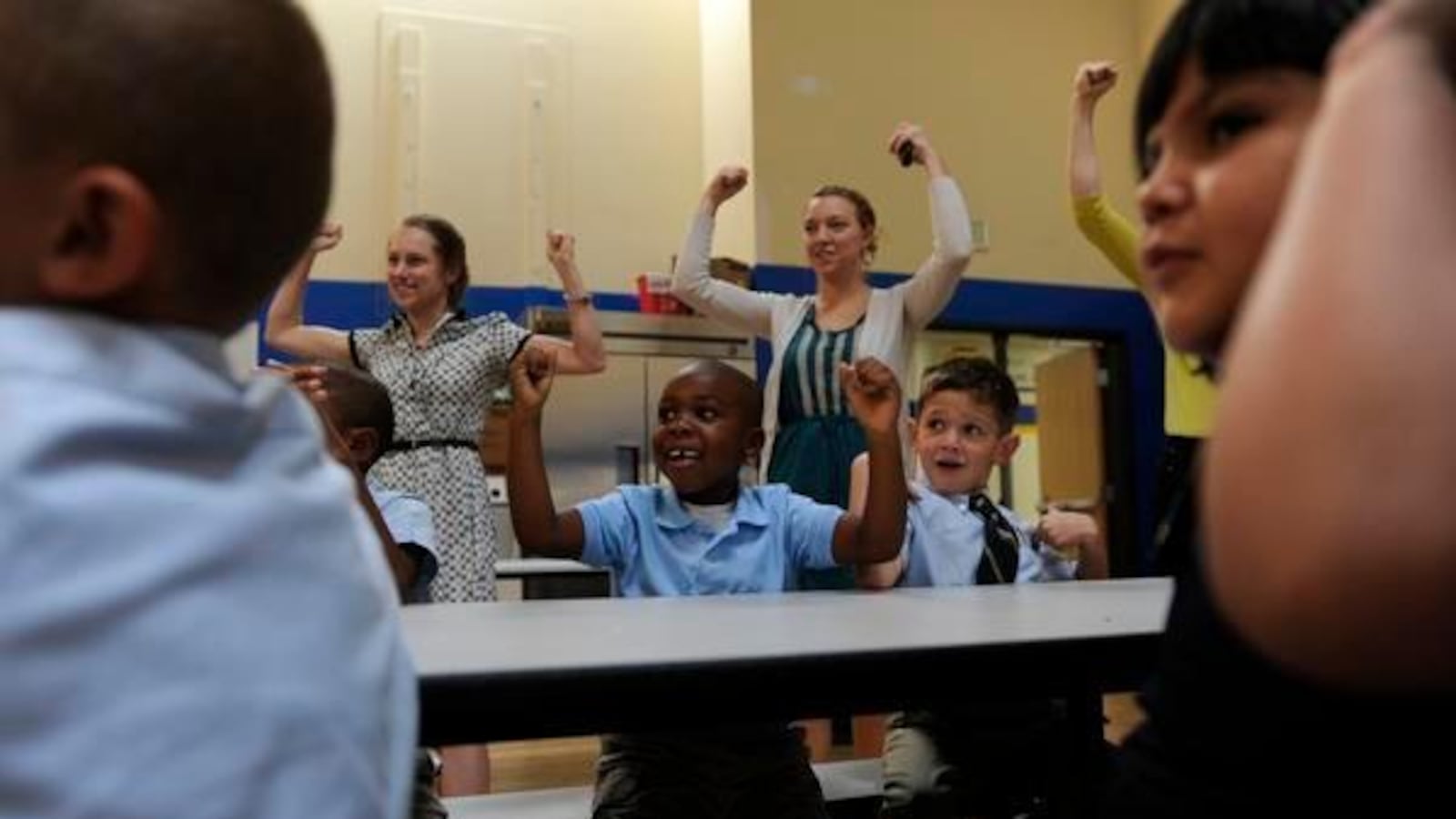 Students and staffers at Rocky Mountain Prep's first charter school in Denver cheer in 2012. (Photo by The Denver Post)