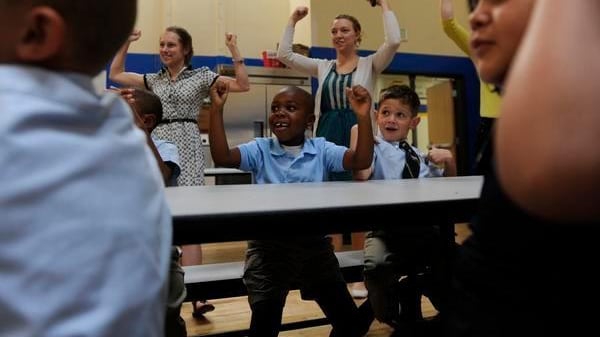 Students and staffers at Rocky Mountain Prep's first charter school in Denver cheer in 2012. (Photo by The Denver Post)
