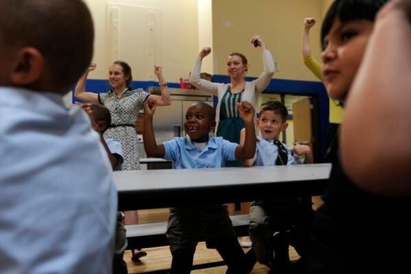 Students and staffers at Rocky Mountain Prep's first charter school in Denver cheer in 2012. (Photo by The Denver Post)