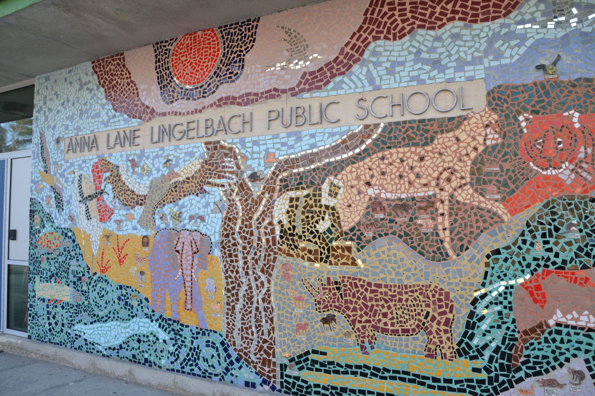 A mosaic wall of a scene of animals at Anna Lane Lingelbach Public School.