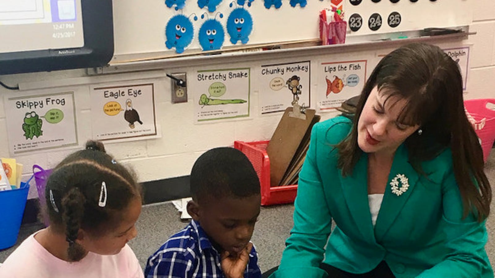 Outgoing Tennessee Education Commissioner Candice McQueen reads to students during one of her classroom tours. (Photo courtesy of Tennessee Department of Education)