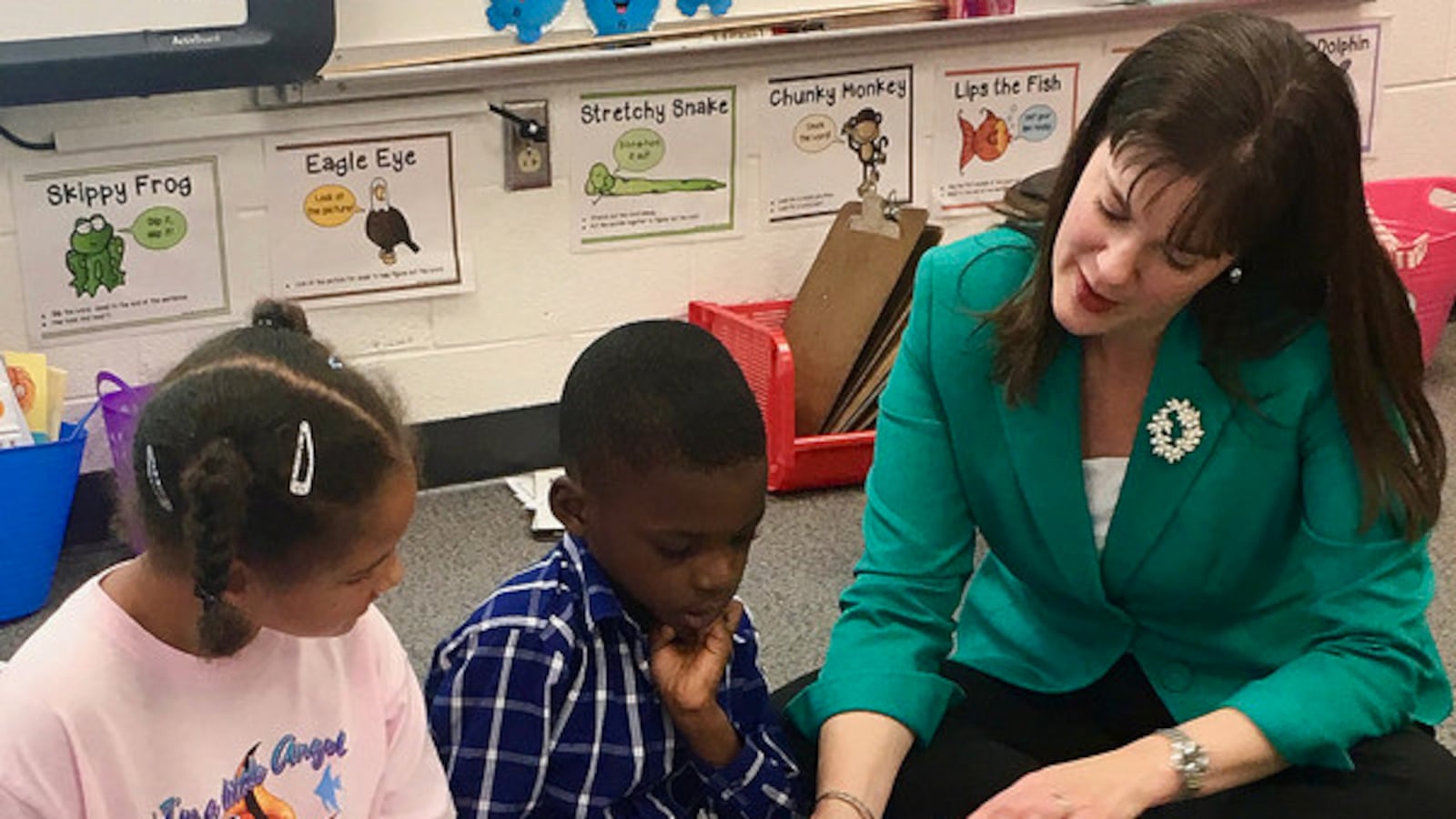 Outgoing Tennessee Education Commissioner Candice McQueen reads to students during one of her classroom tours. (Photo courtesy of Tennessee Department of Education)