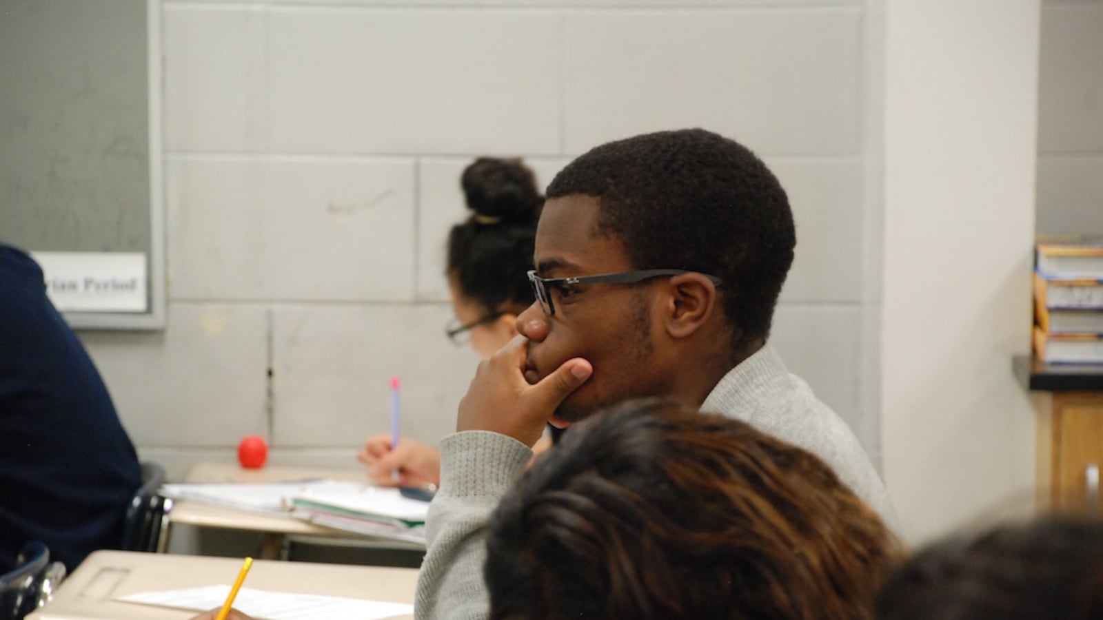 An Aurora Central High School student listens during his advanced science class in 2015.