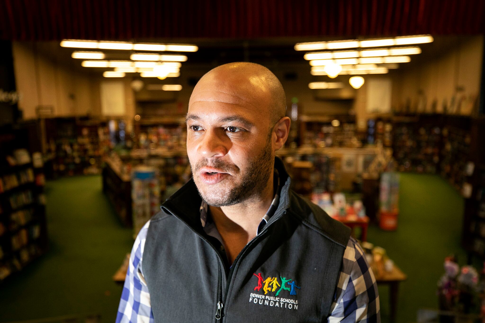 A man stands in a bookstore.