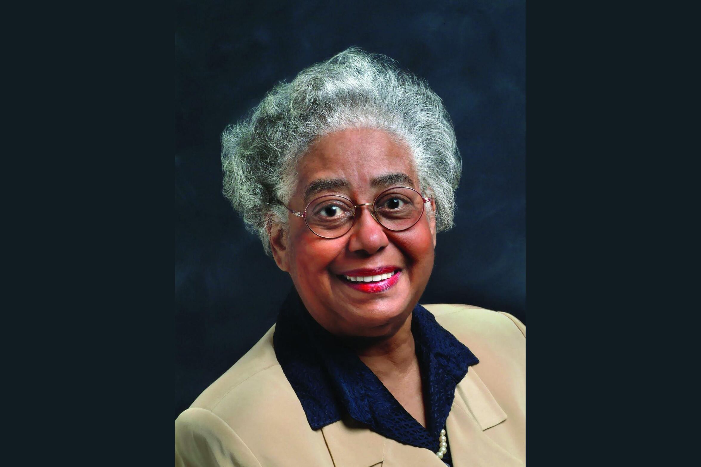 Portrait of Constance Clayton in a beige suit