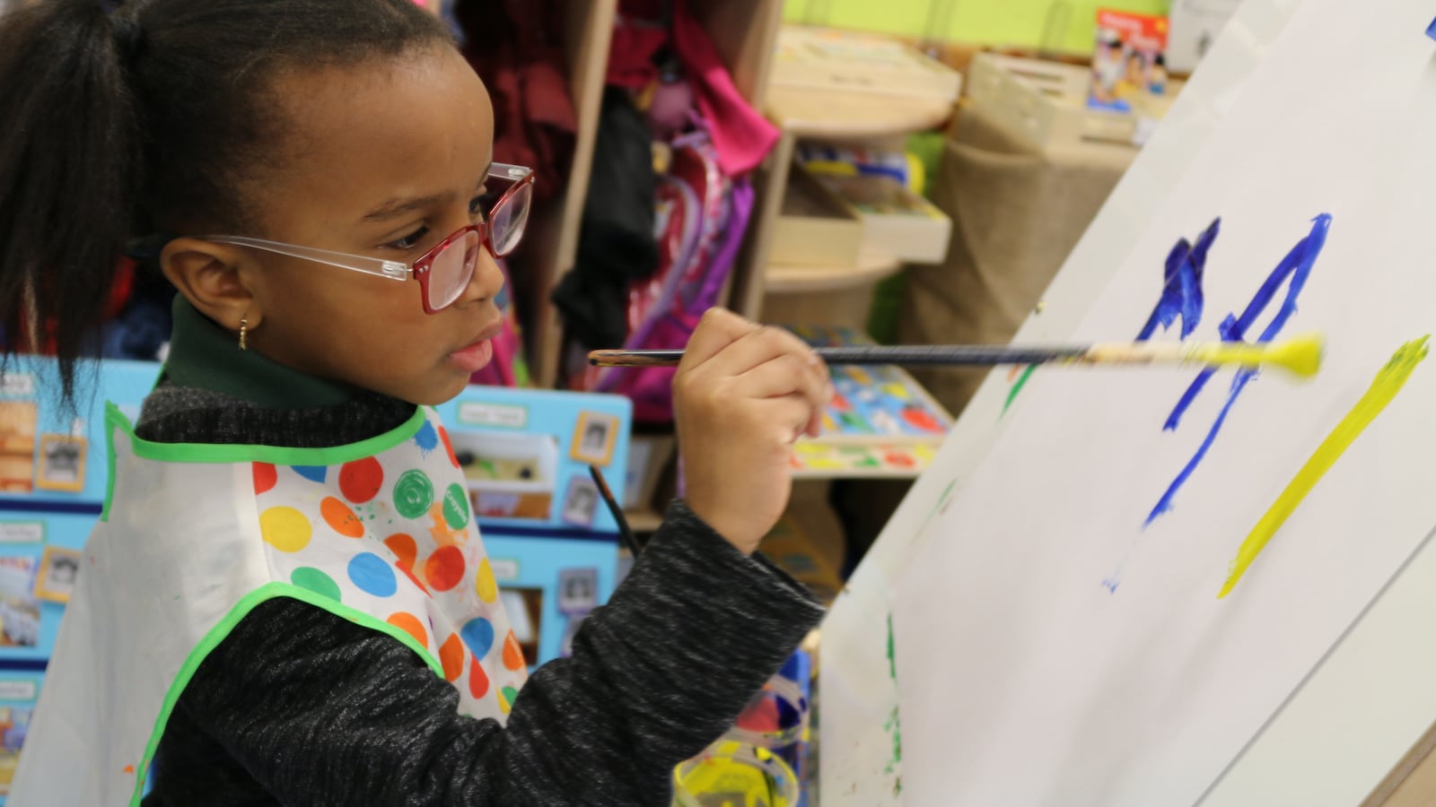 A student at P.S. 69 Journey Prep in the Bronx paints a picture. The school uses a Reggio Emilia approach and is in the city's Showcase Schools program.