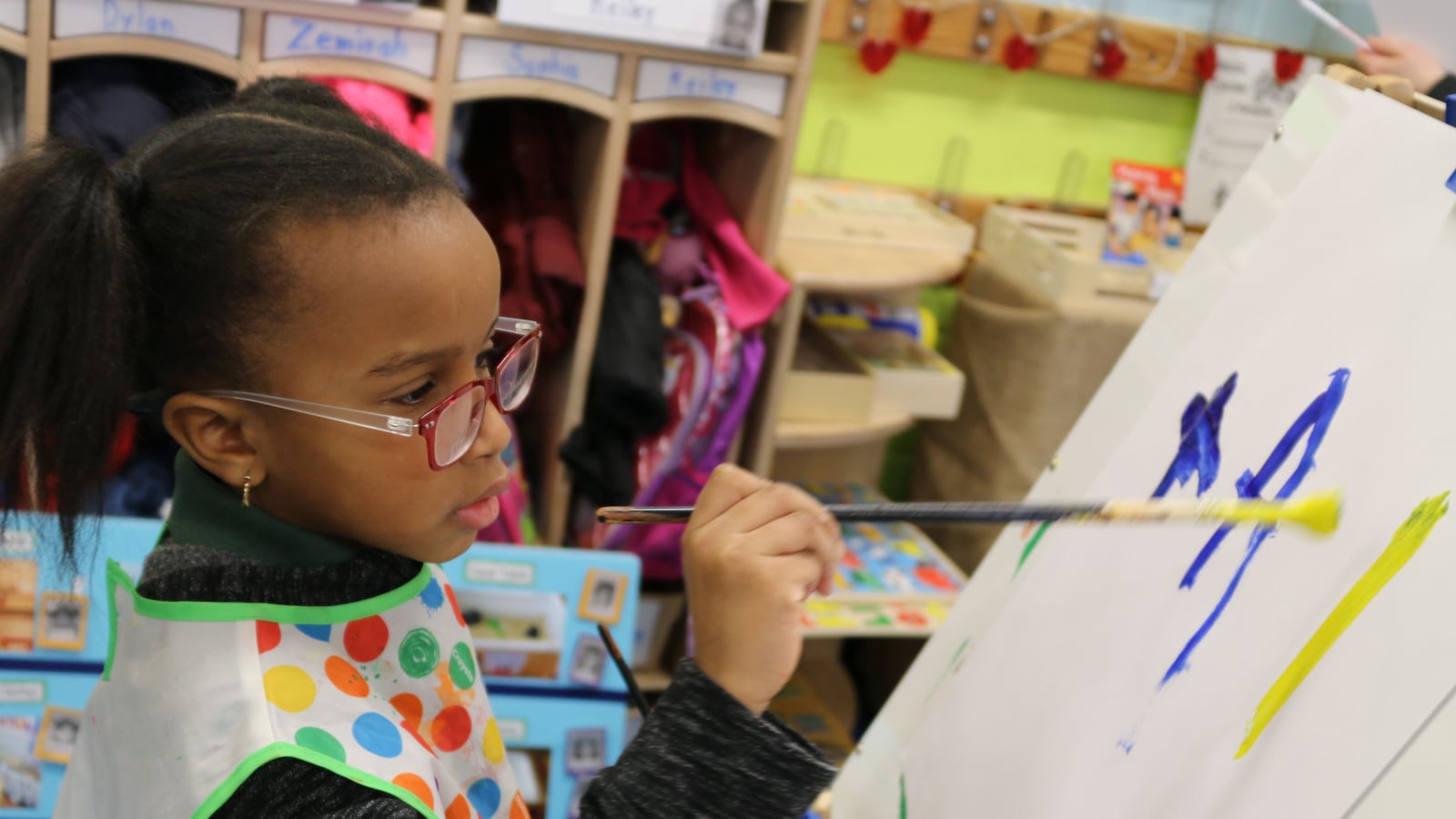A student at P.S. 69 Journey Prep in the Bronx paints a picture. The school uses a Reggio Emilia approach and is in the city's Showcase Schools program.