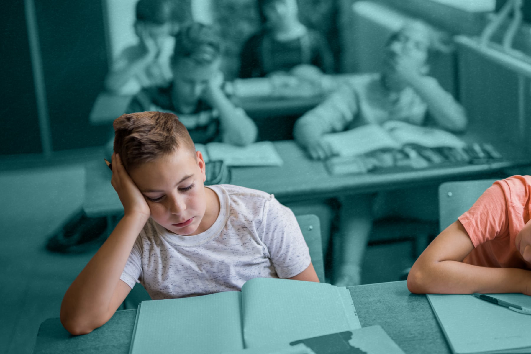 Students in a classroom resting their heads on their desks in boredom.