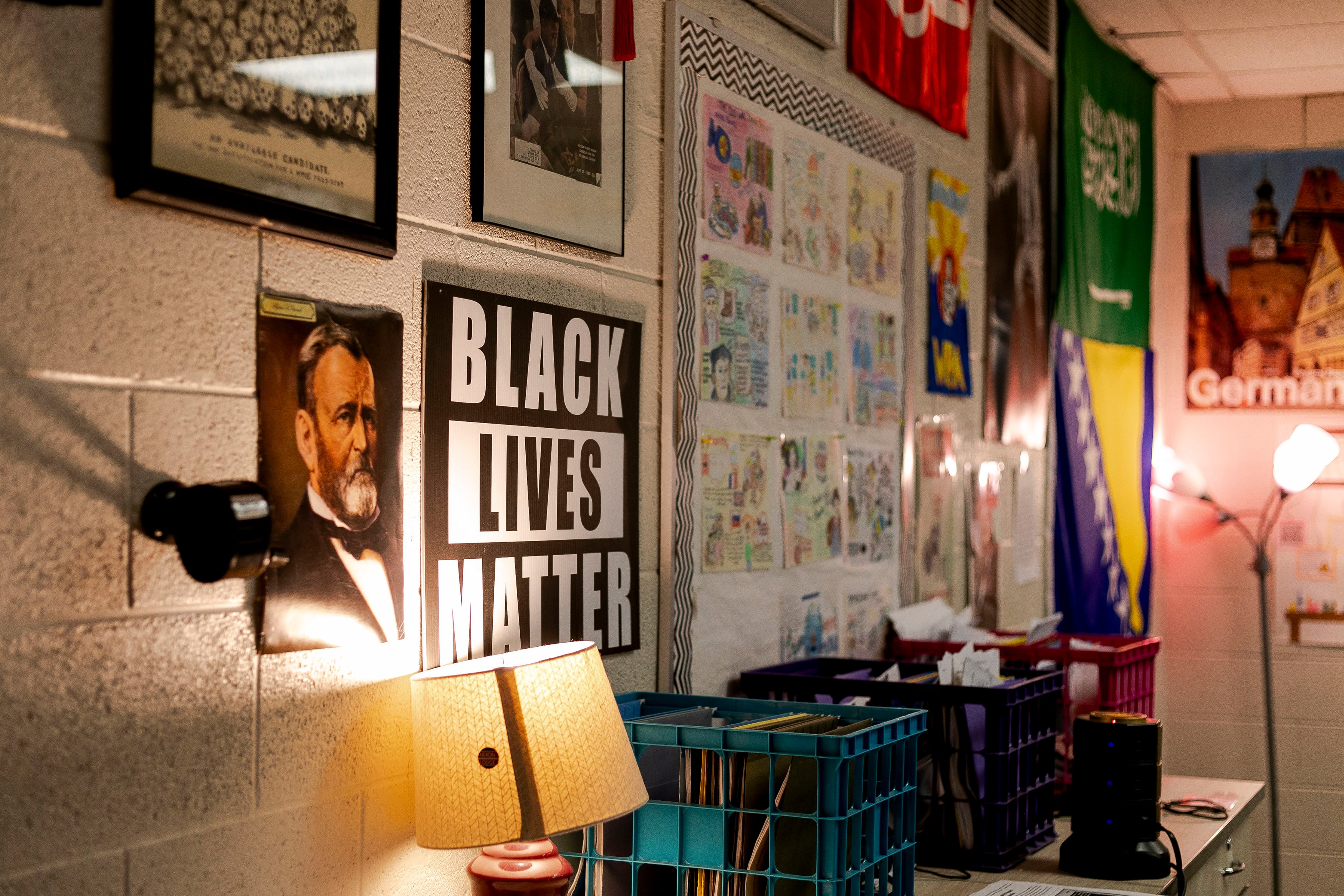 A wall of posters in a high school history class, one poster reads "Black Lives Matter".