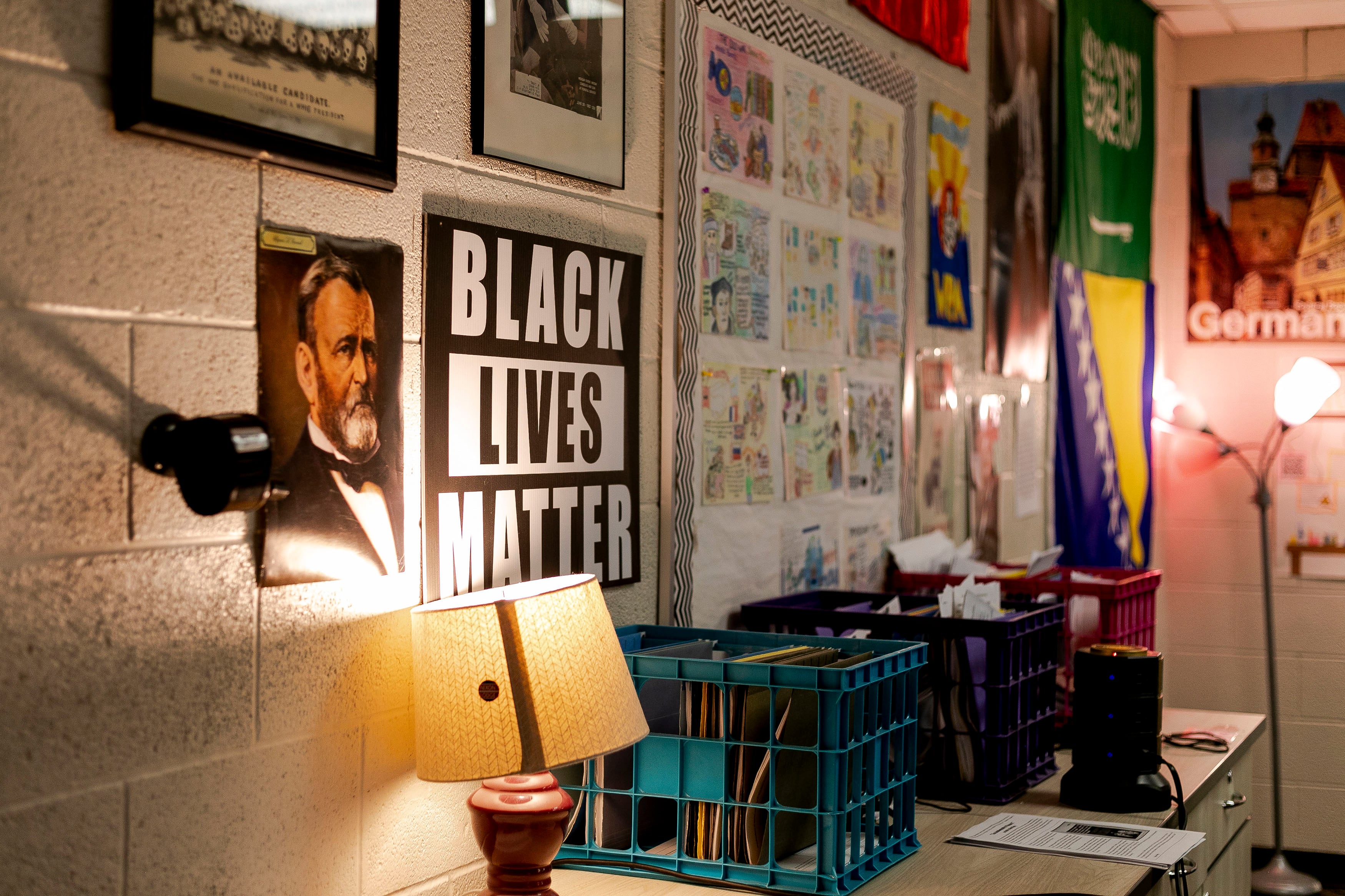 A wall of posters in a high school history class, one poster reads "Black Lives Matter".