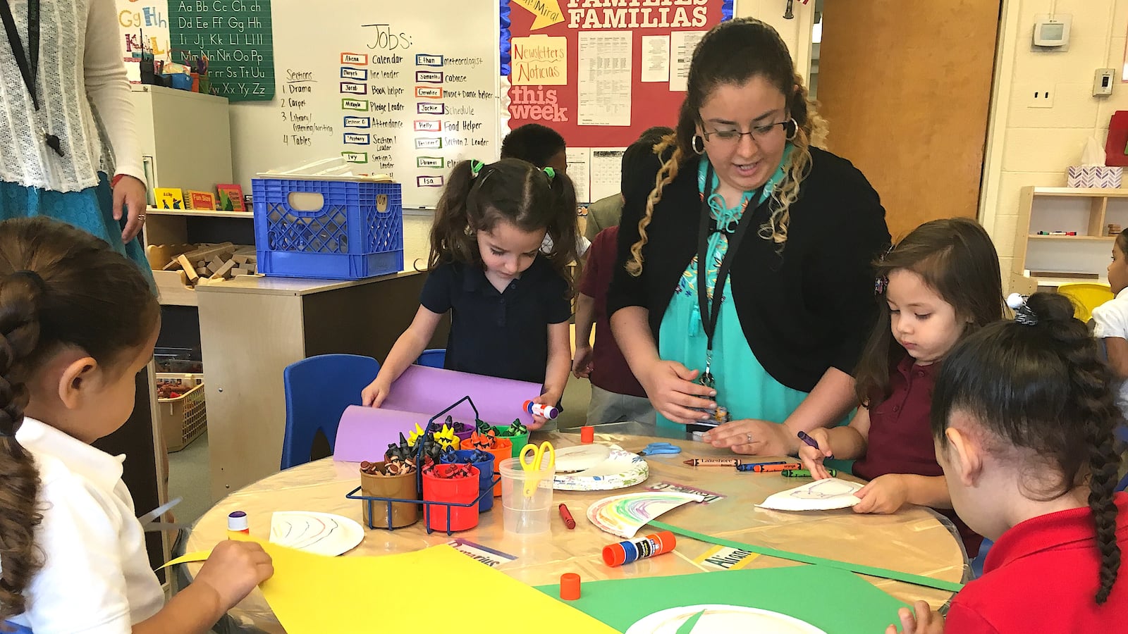 A staff member works with full-day preschoolers at Fairview Elementary School in 2016,