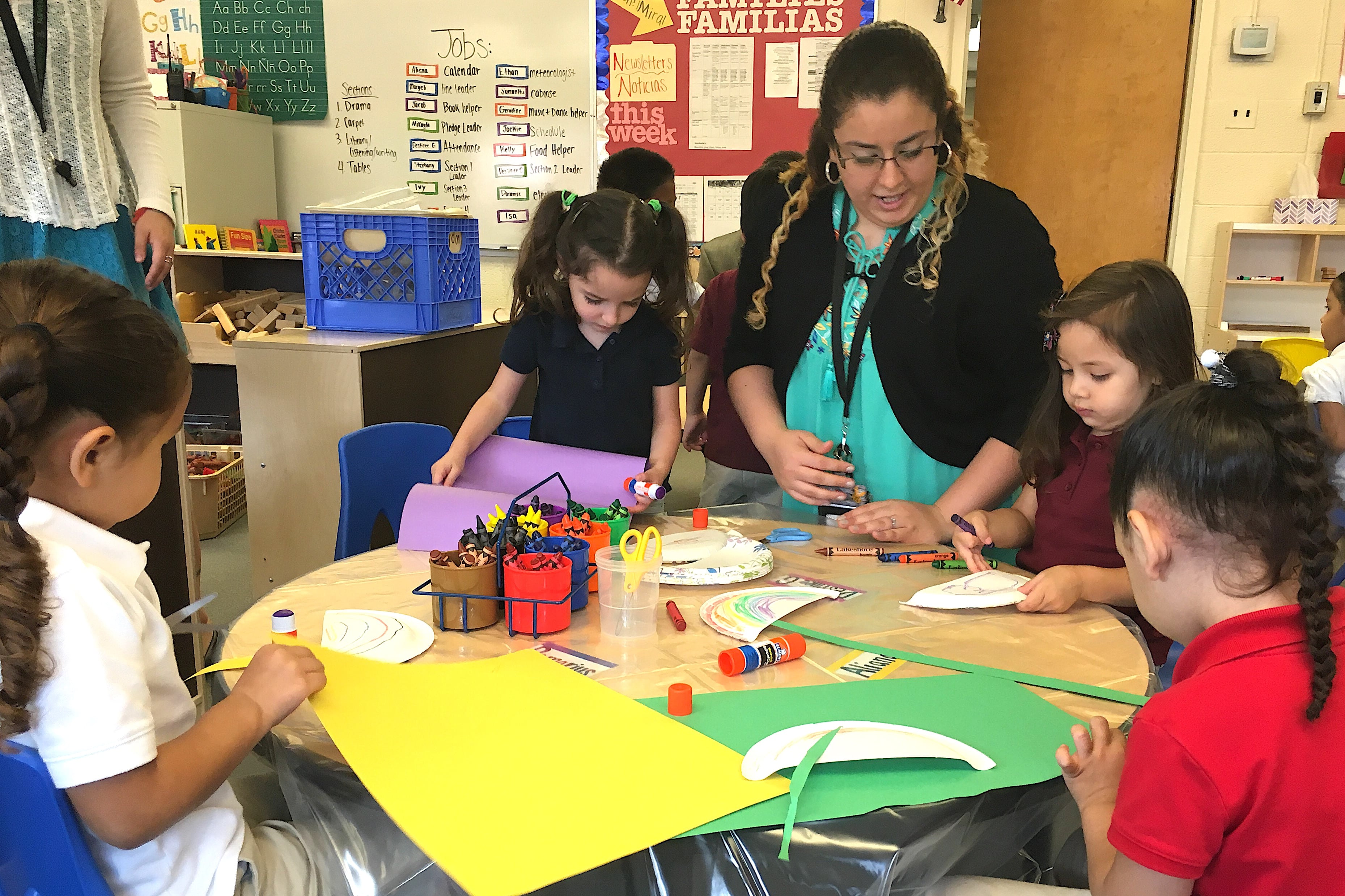 A staff member works with full-day preschoolers at Fairview Elementary School in 2016,