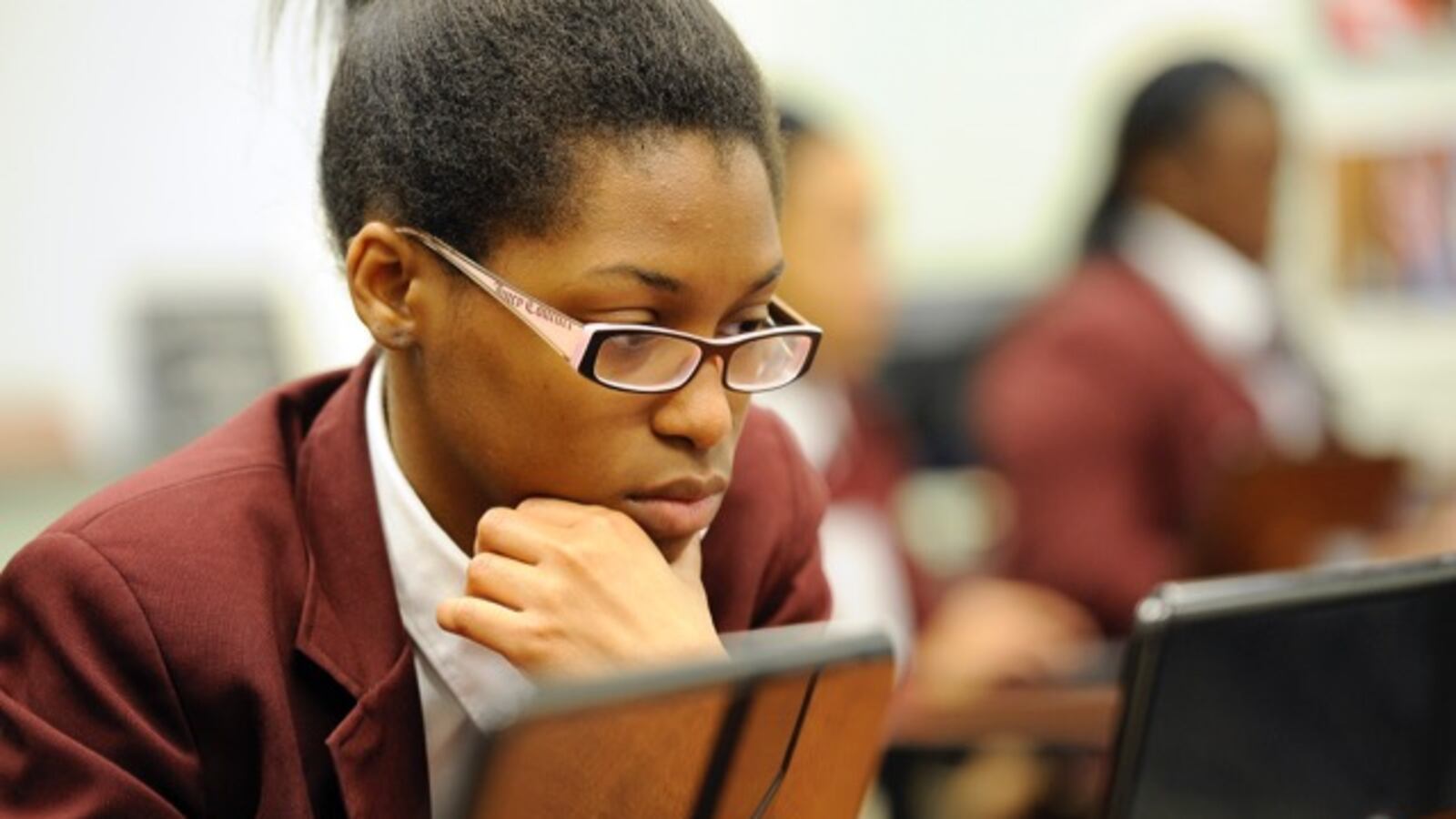 Kayla Davis works on a college admissions form. Stock photos for Chalkbeat stories. Photos made at Tindley Accelerated School, 3960 Meadows Dr, Indianapolis, Indiana.  Nov. 22, 2013. (Photo by Alan Petersime)