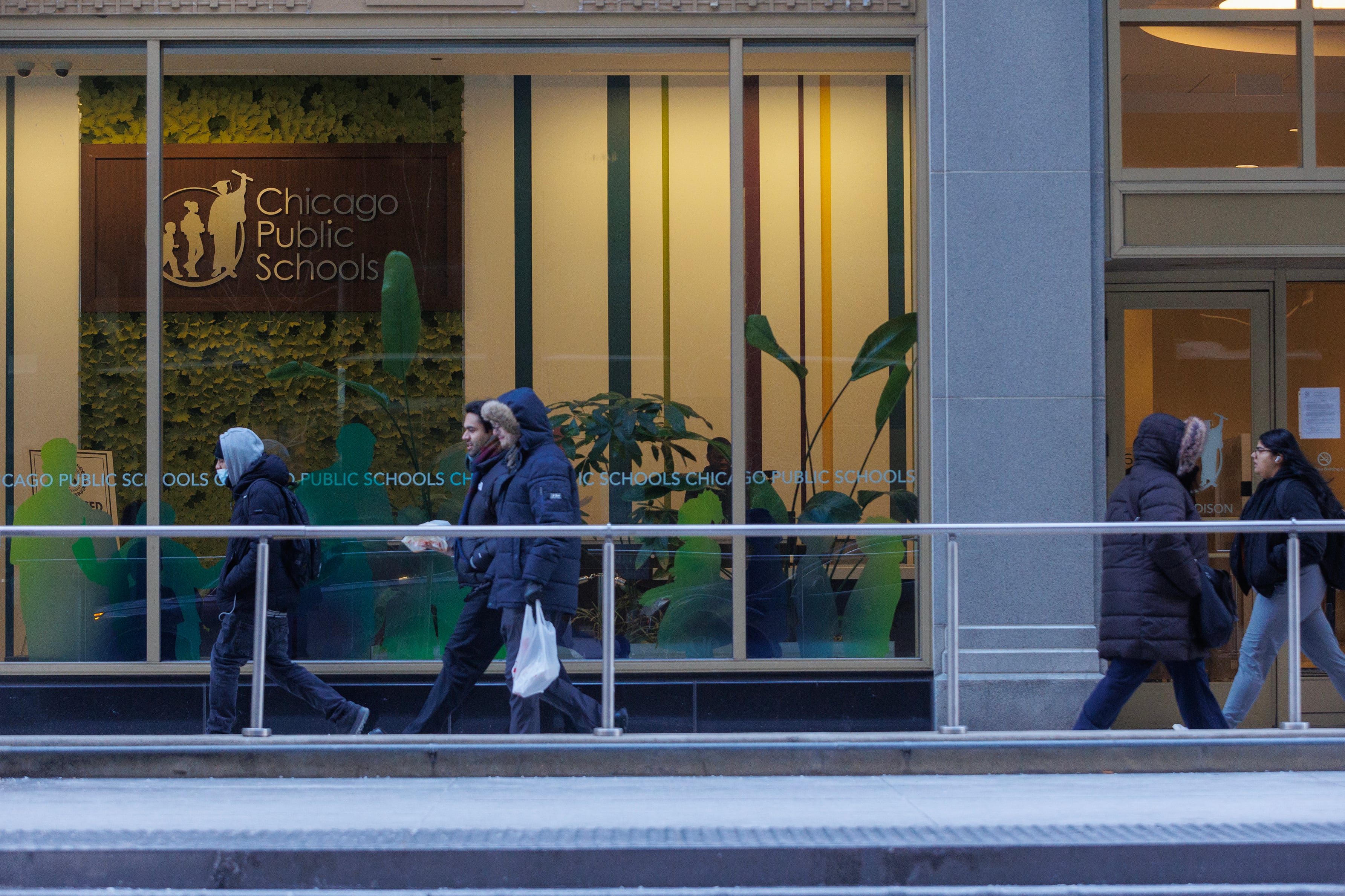 The front of a building with writing on the window.