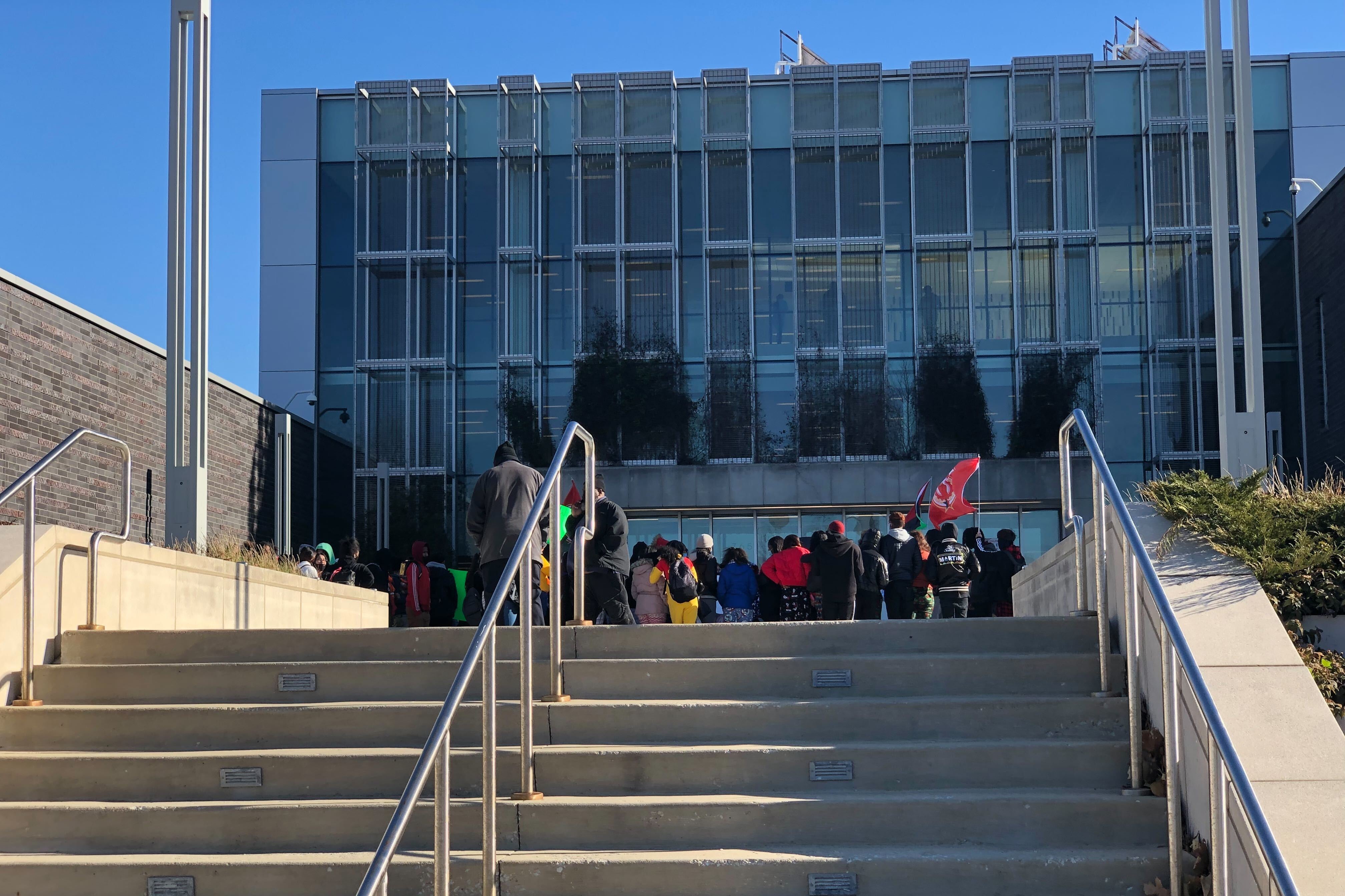 A group of students walk out of school in protest against alleged racism at Sarah E. Goode STEM Academy.