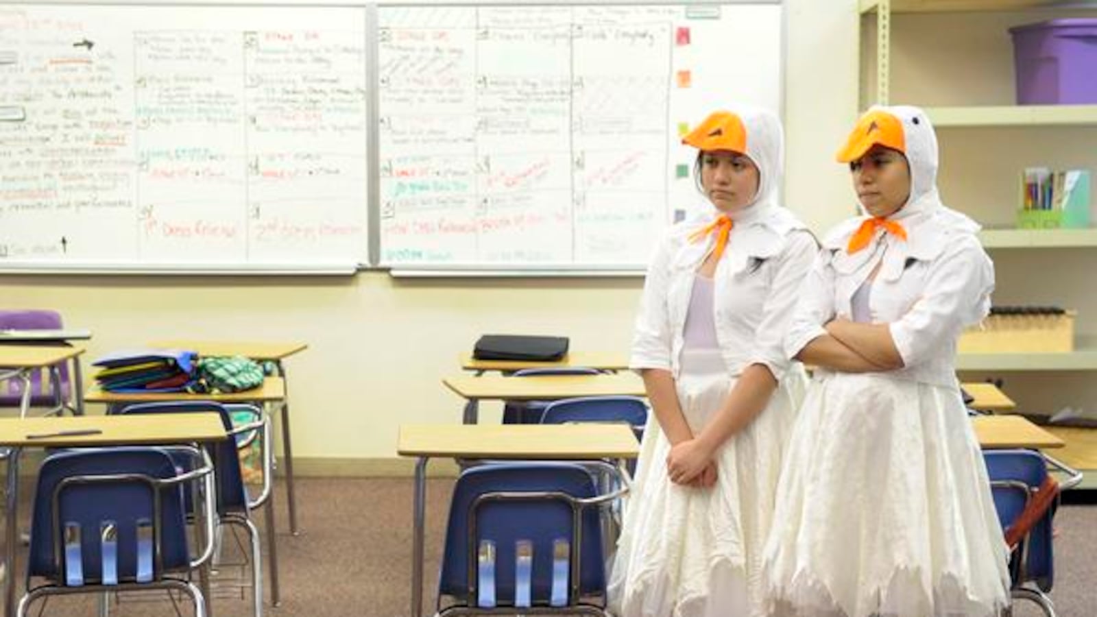 Noel Community Arts School sixth-graders Serenity Casillas, 12, left, and Sonia Lizardo, 12, watch fellow actors in the drama class run through several scenes from "The Aristocats" in April 2012.