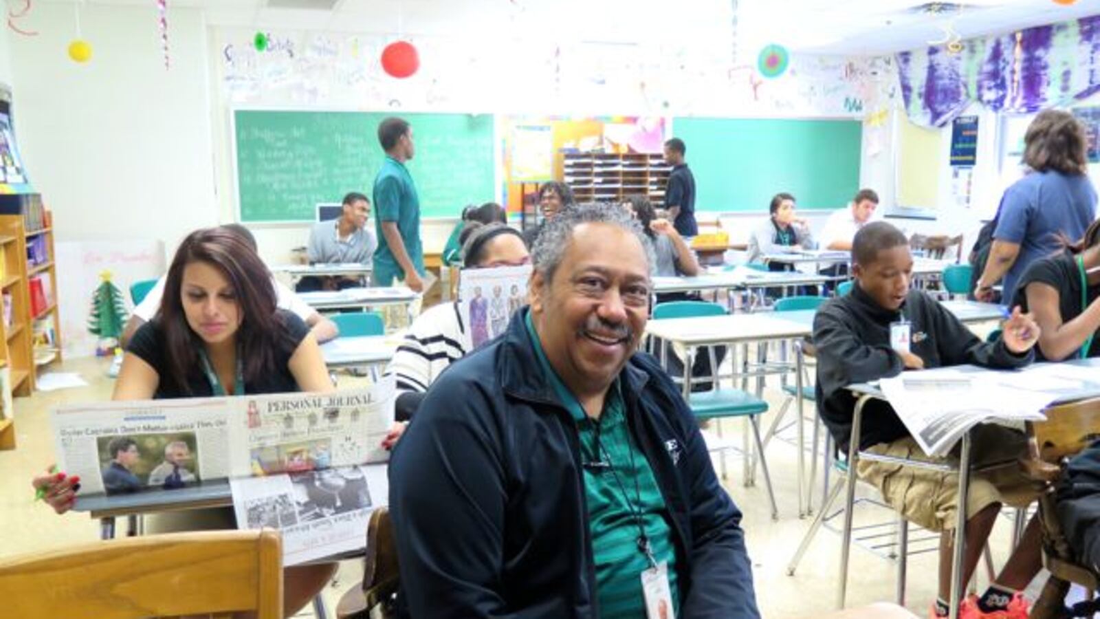 School board member Michael Brown sits in an English classroom at Northwest High School. Brown is running for reelection this fall.