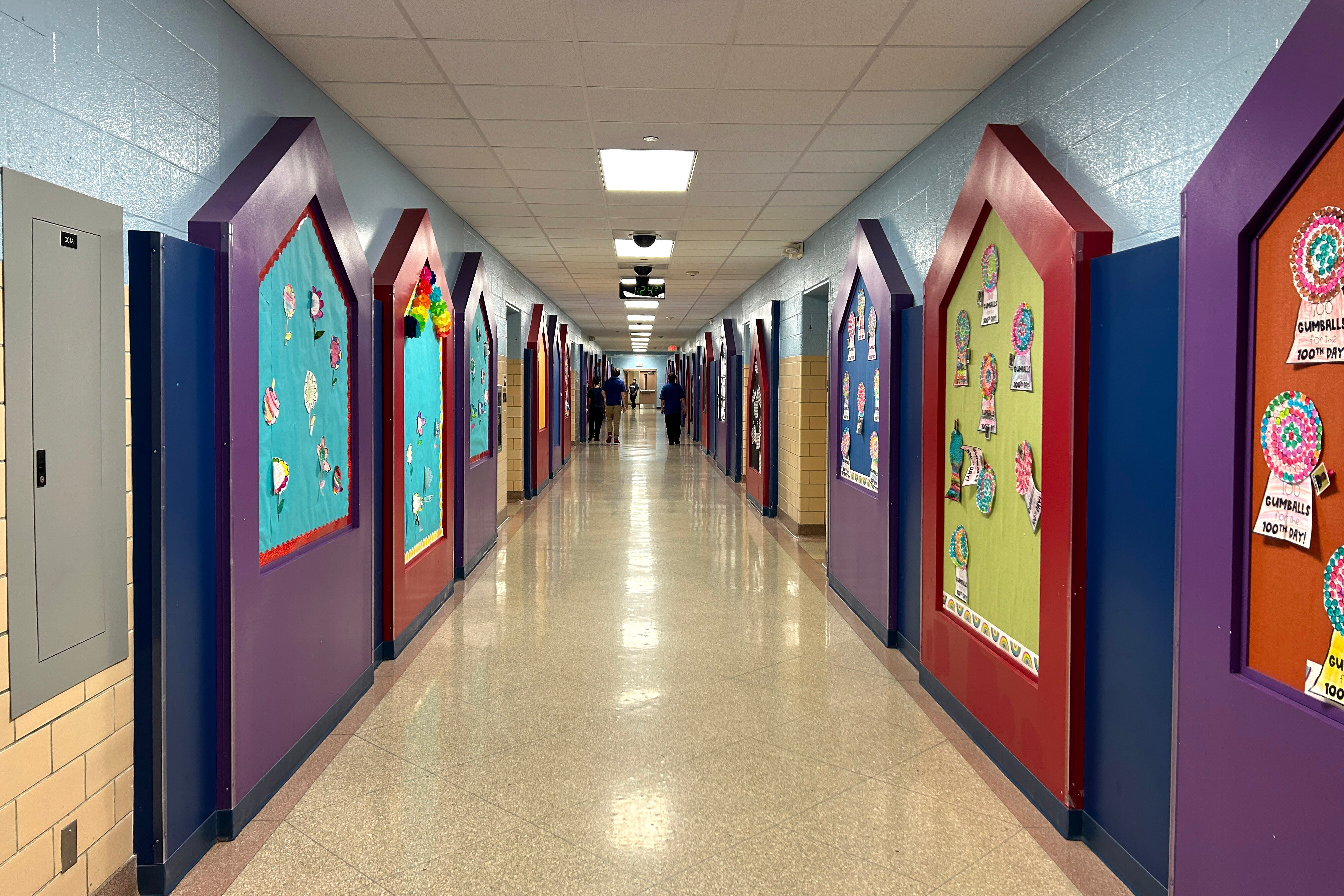 A school hallway with brightly colored decorations on the walls.