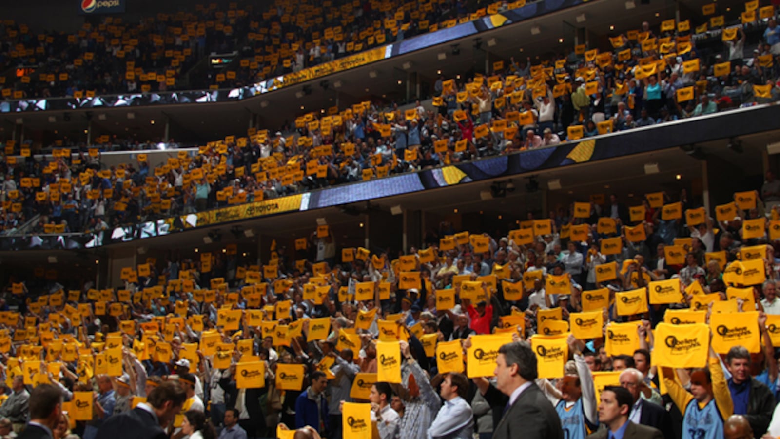 Memphis Grizzlies fans raise their growl towels during an NBA game at the FedEx Forum on April 25, 2013.