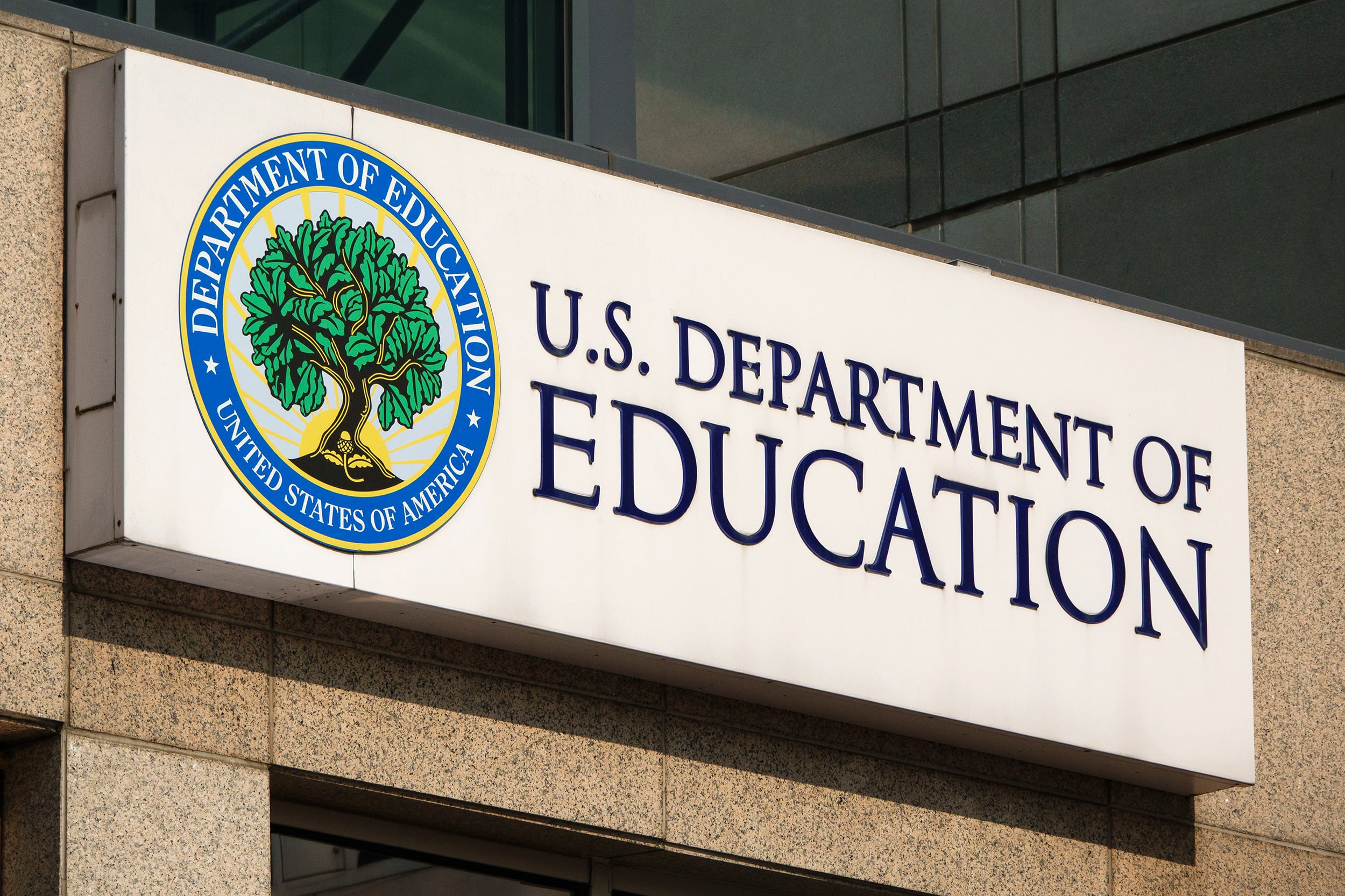 Department of Education Exterior logo on a sunny day.