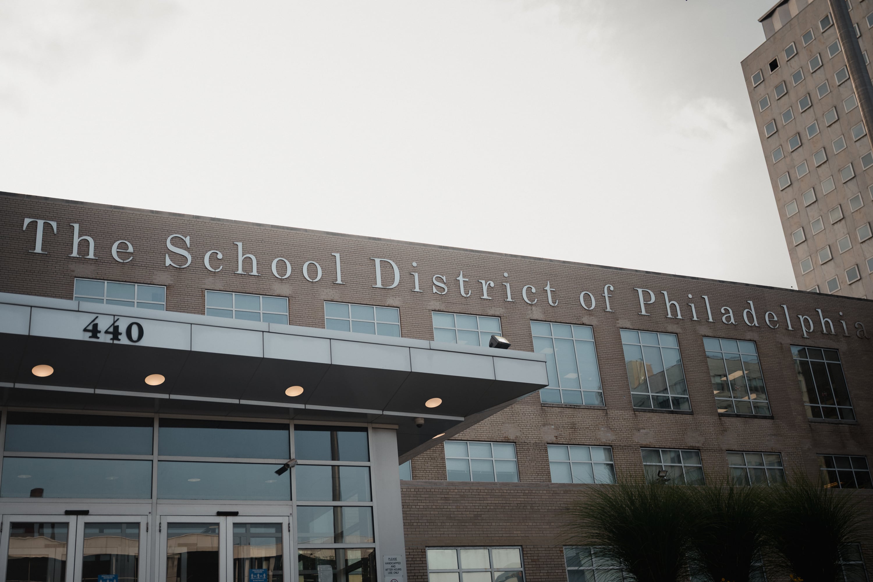 The exterior of a sand-colored building.