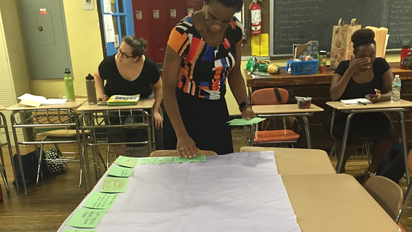 Rajihah Coaxum making a version of the "centerpiece" for teachers participating in the NYC Math Lab.
