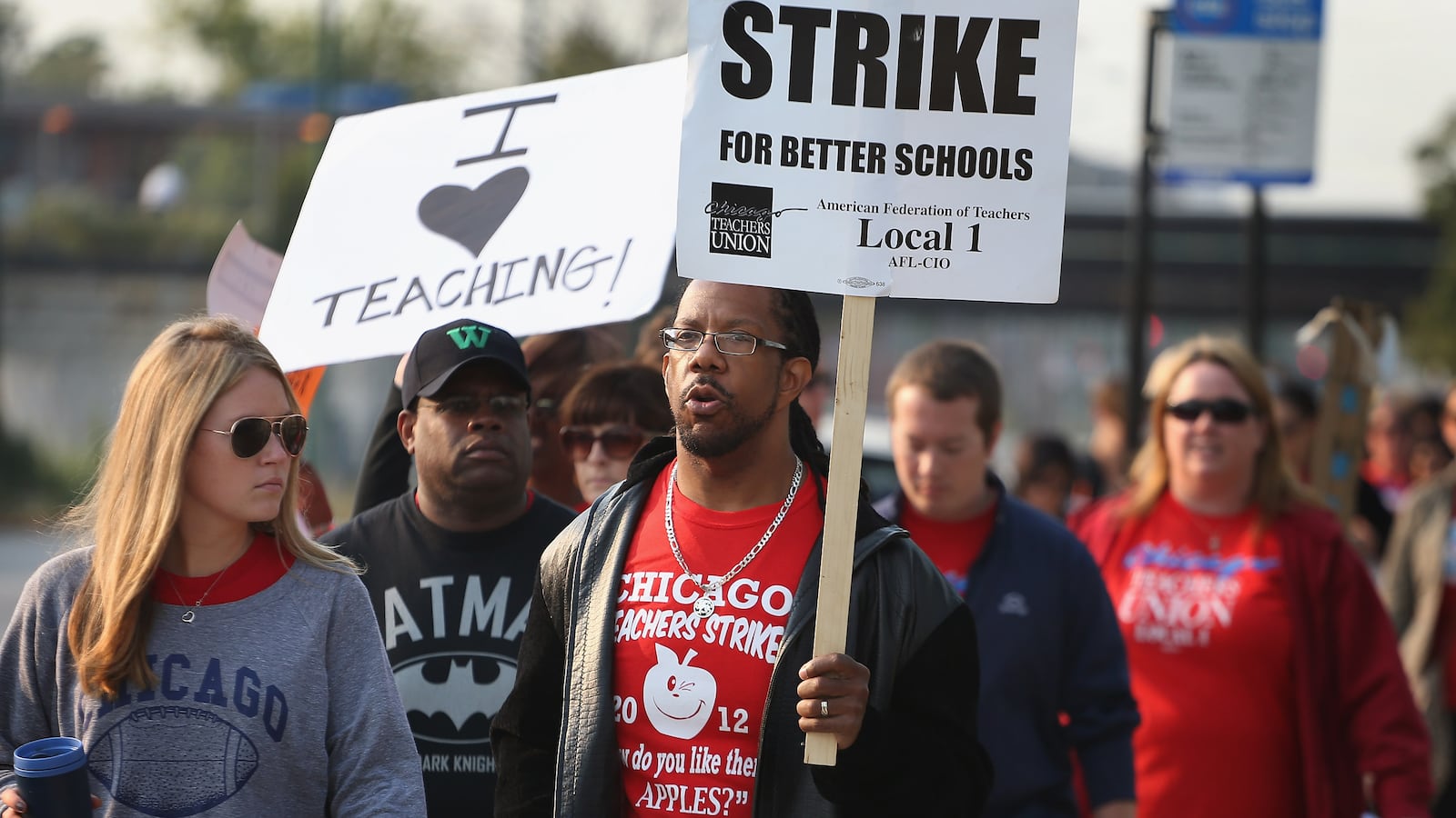 Striking Chicago public school teachers picket outside of George Westinghouse College Prep high school in 2012.