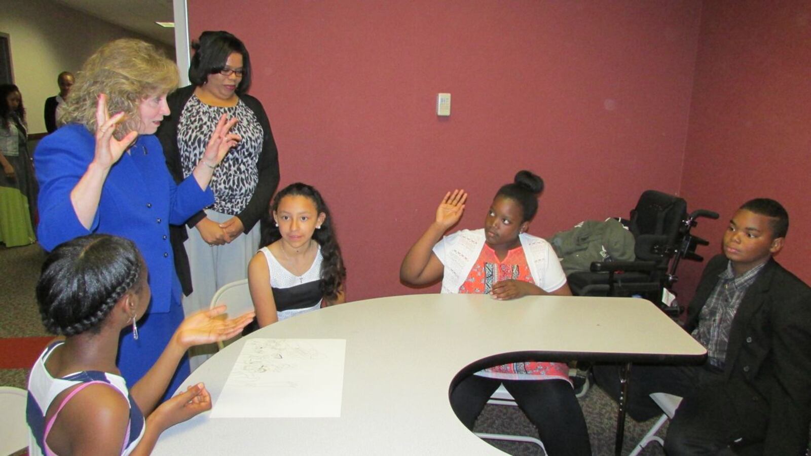 Indiana State Superintendent Glenda Ritz speaks with Central Elementary School's Academic Super Bowl Team in Pike Township today as Principal Erica Porter looks on.