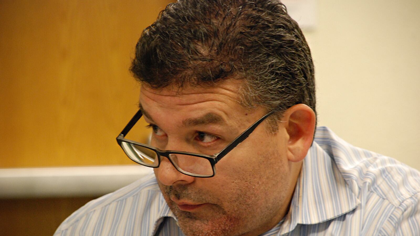 Aurora Central High School's interim principal Gerardo De La Garza at a meeting in February.
