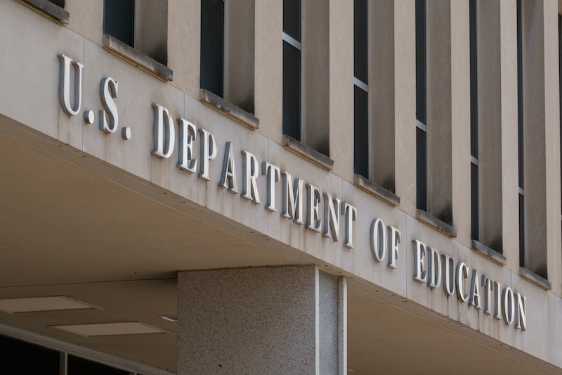 The name of a building stands on the outside.