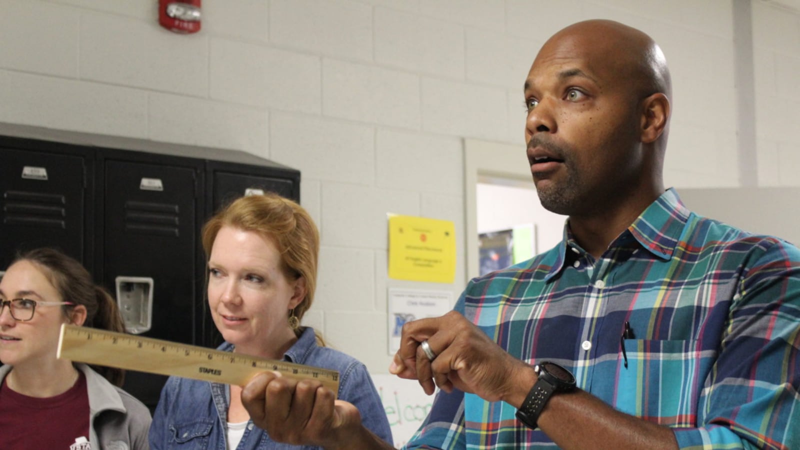 Fourth grade science teachers Lamarcus Marks, of Rivercrest Elementary, and Angie Clement, of Bartlett Elementary, test out a lesson on kinetic and potential energy at Arlington High School, one of 11 statewide sites where Tennessee teachers are training for next year's new science standards.