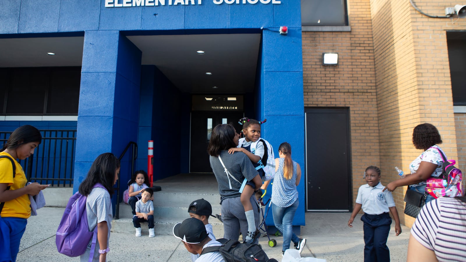 Students stand outside Nelson Mandela Elementary School in Newark.