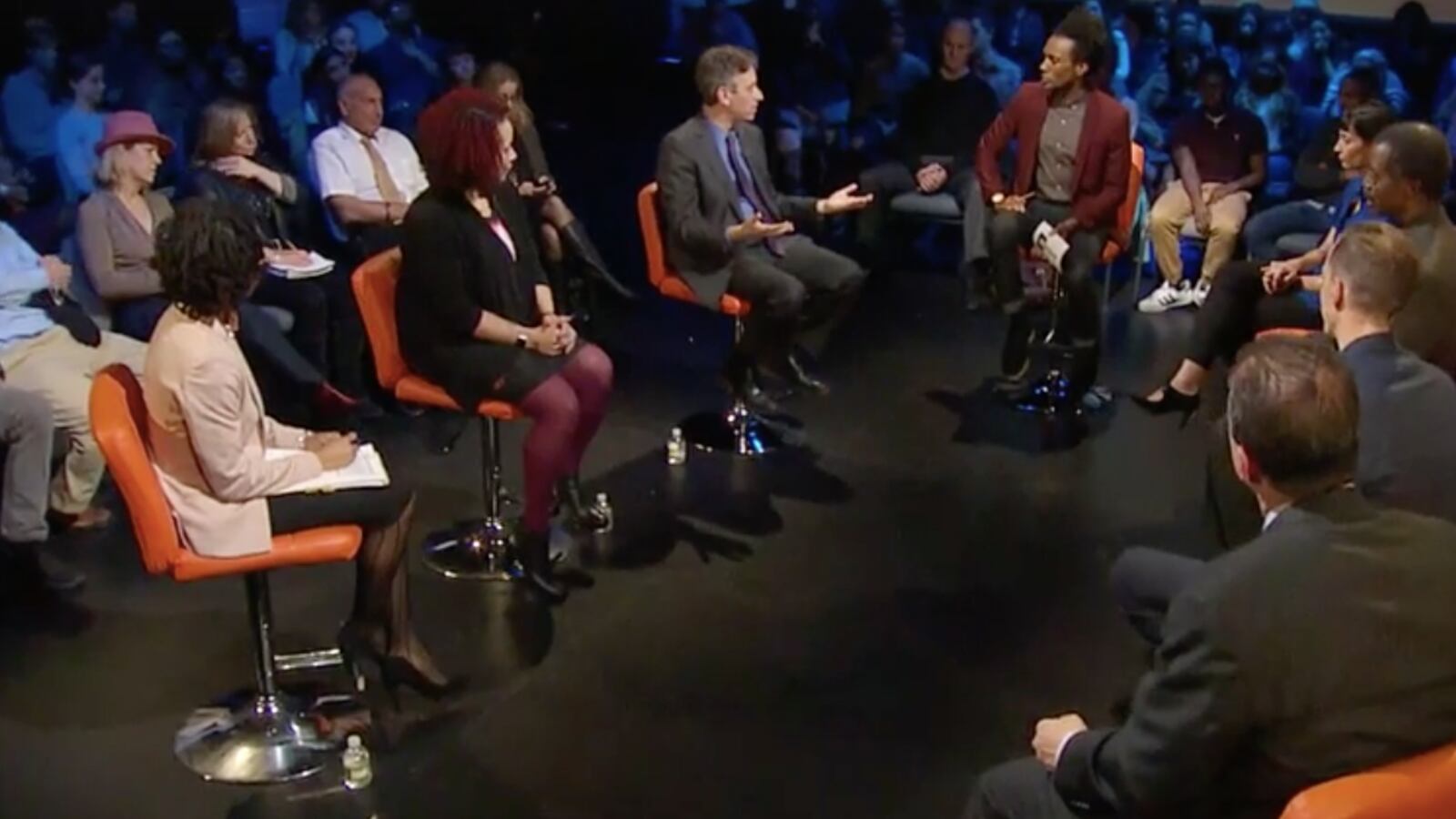 Deputy Chancellor Josh Wallack, third from left, discussing the city's integration efforts.