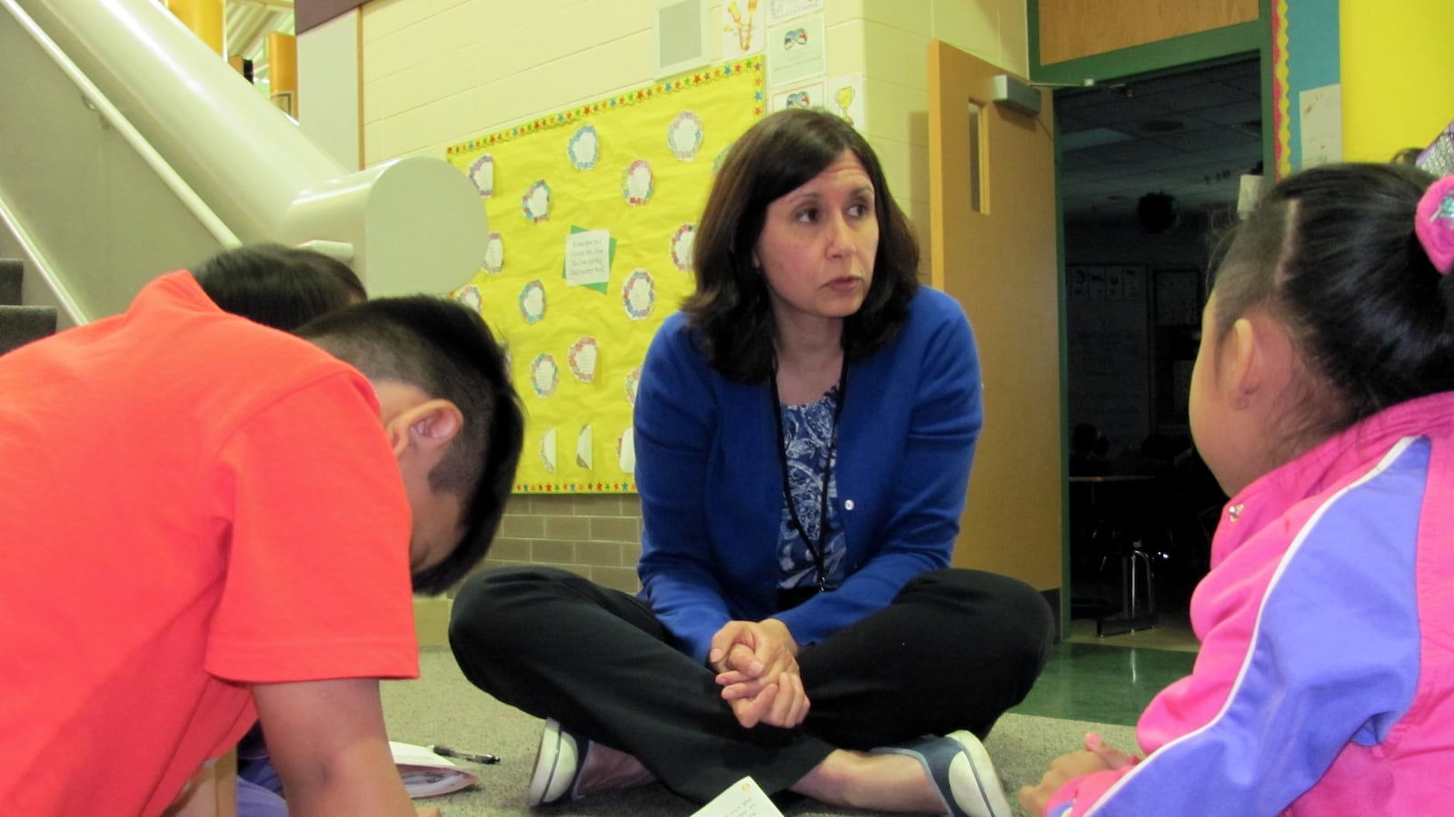 Carol Hofer, a teacher at Fox Hill Elementary School, works with English learners in a small group lesson. Teachers with special skills such as an English learner certification are harder for districts to recruit.
