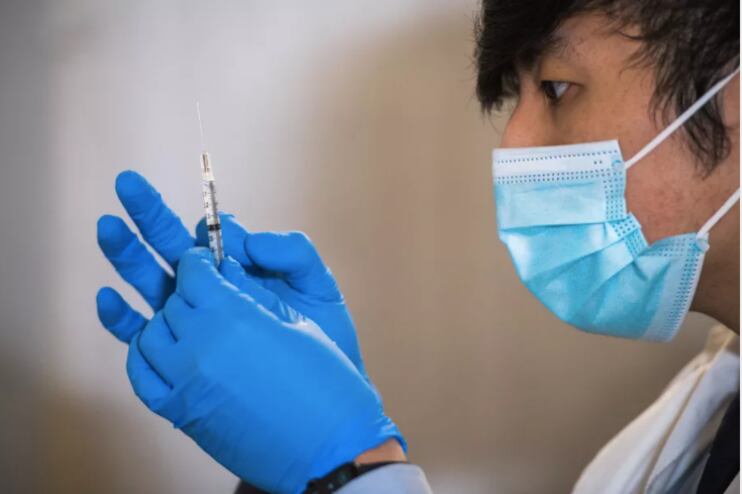 A healthcare worker prepares to deliver a coronavirus vaccine shot in East Harlem, Jan. 15, 2021.