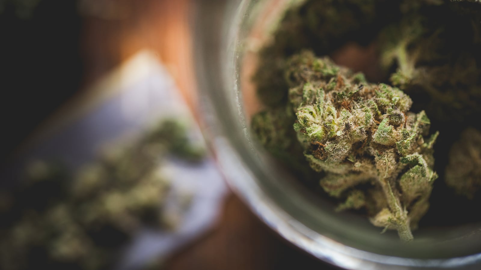 A jar filled with with marijuana.