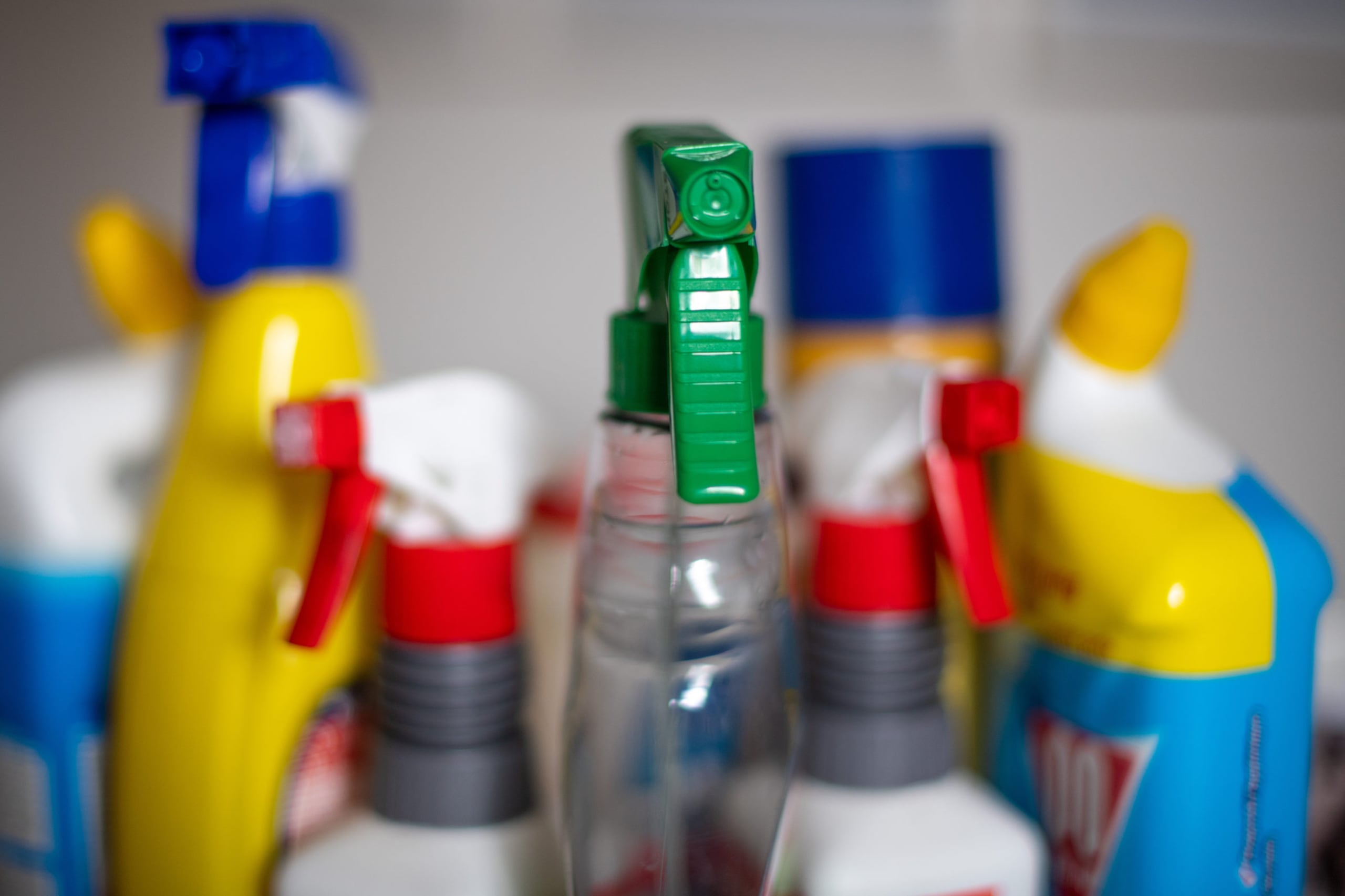 A close up photograph of cleaning supply bottles.