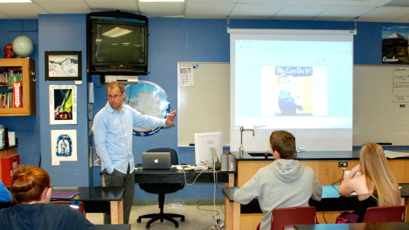 Highlands Ranch High School science teacher Bob MacArthur leads a class discussion May 16 on propaganda art. His ninth grade science class was asked to design a propaganda poster in support of an energy source they have been studying.