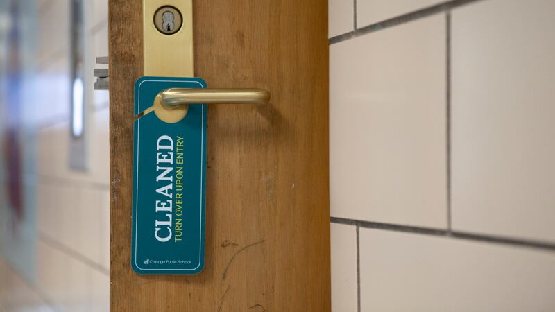 A sign hanging on a doorknob that indicates that the room has recently been cleaned.