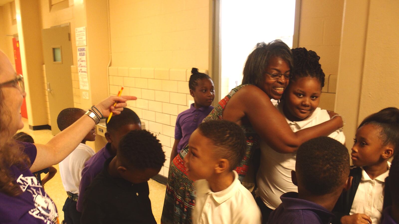 School board member-elect Joyce Dorse-Coleman greets students at Dunbar Elementary, a school she helped organize to keep from closing in 2017.