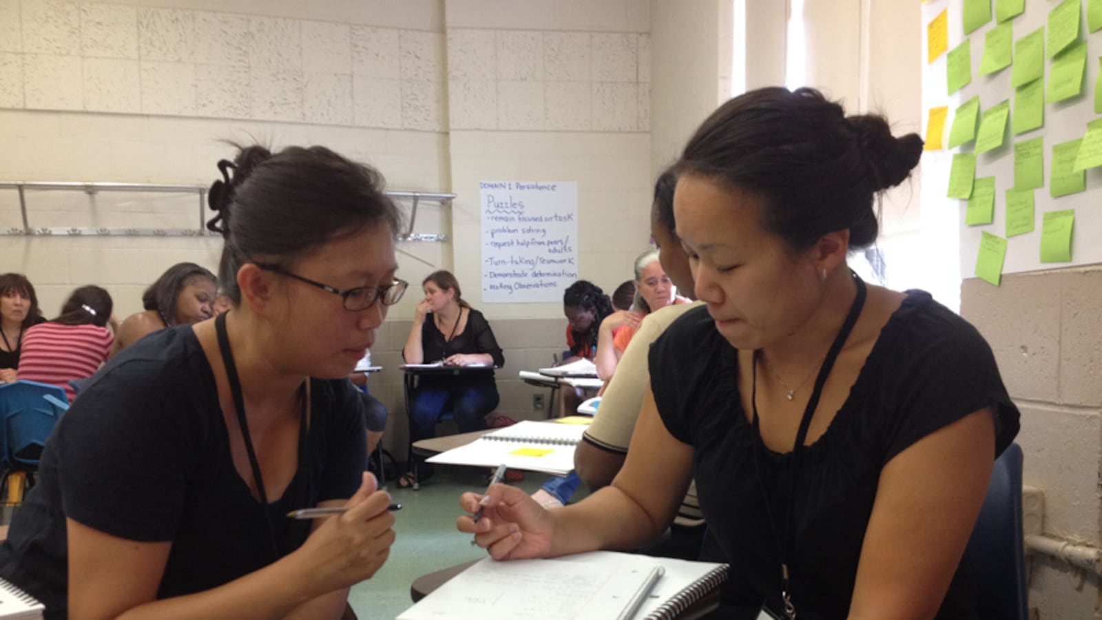 Janet Lo (left) and Stacey Gong-Zhang attend a training program for pre-K teachers.