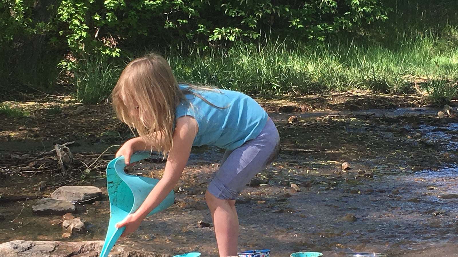 A girl plays during a Worldmind Nature Immersion School class at Matthews/Winters Park in Jefferson County.