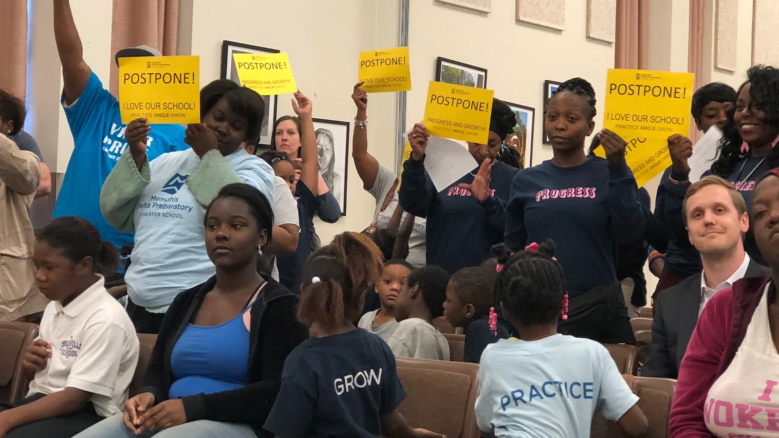 Parents and staff from Memphis Delta Preparatory Charter School urge school board members to delay a vote to close the South Memphis school.