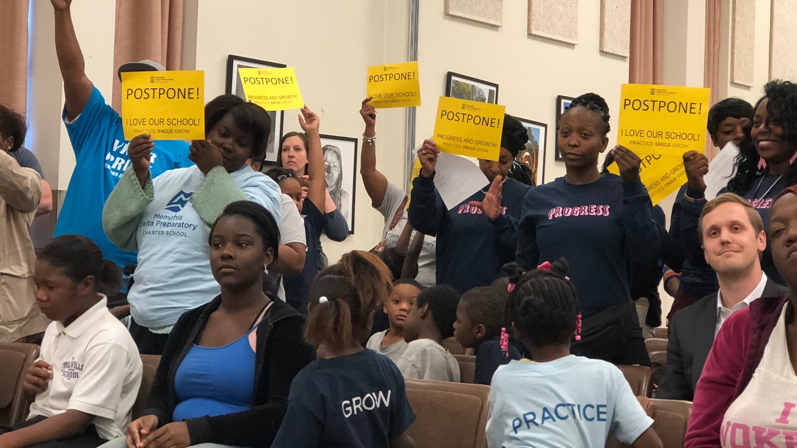 Parents and staff from Memphis Delta Preparatory Charter School urge school board members to delay a vote to close the South Memphis school.