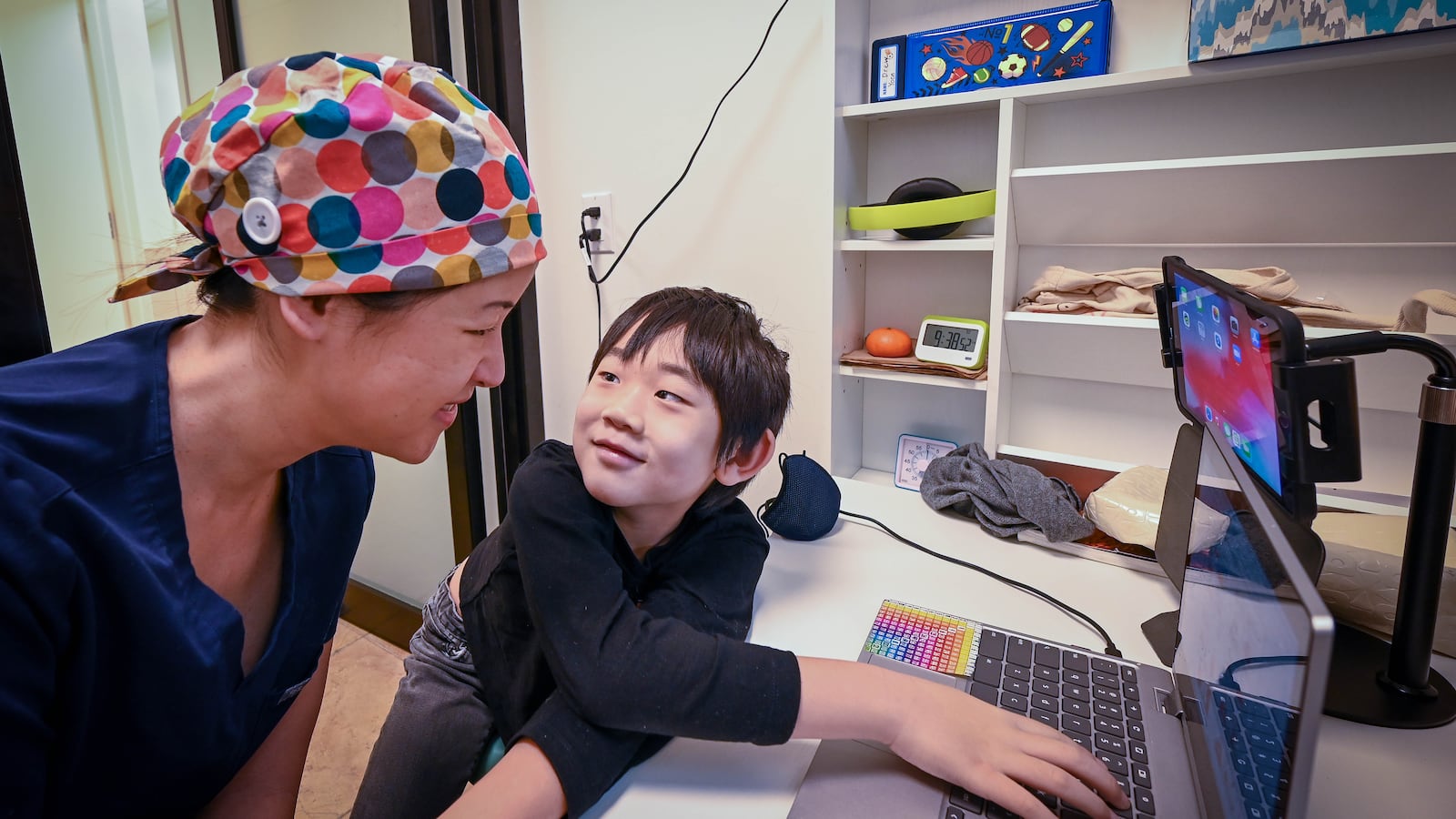 Nancy King is a NYC Ear, Nose and Throat doctor who has been taking her son Drew to her small office to do his online schooling.