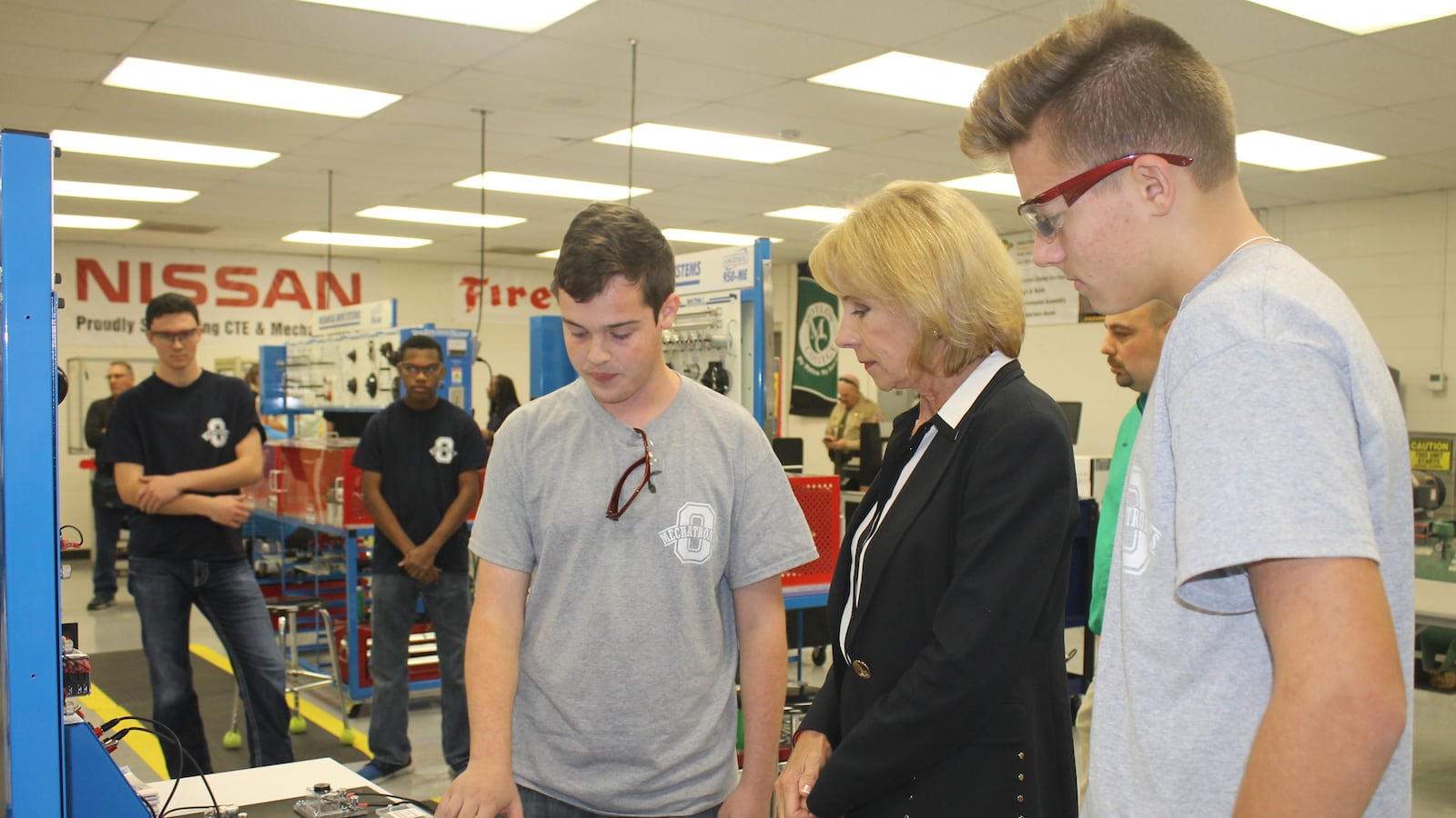 Secretary of Education Betsy DeVos talks with students during a 2017 tour of career and technical education programs at Oakland High School in Murfreesboro, Tennessee.