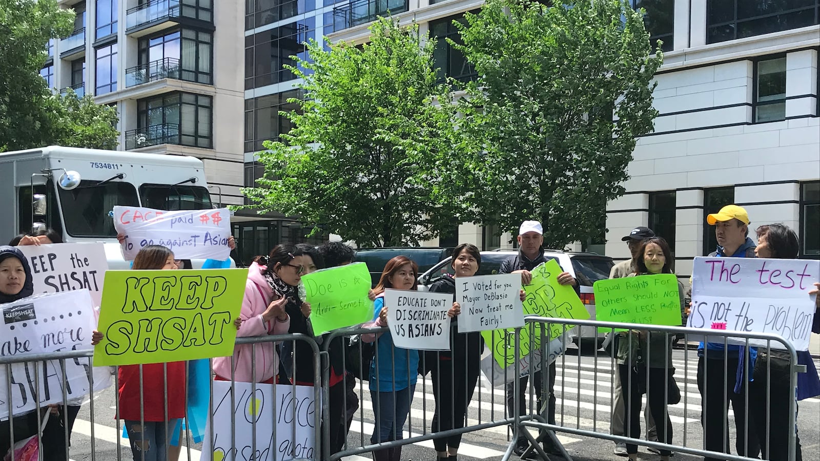 Parents and advocates rallied outside of Gracie Mansion while the mayor held a private meeting about the SHSAT with members of the Asian community.