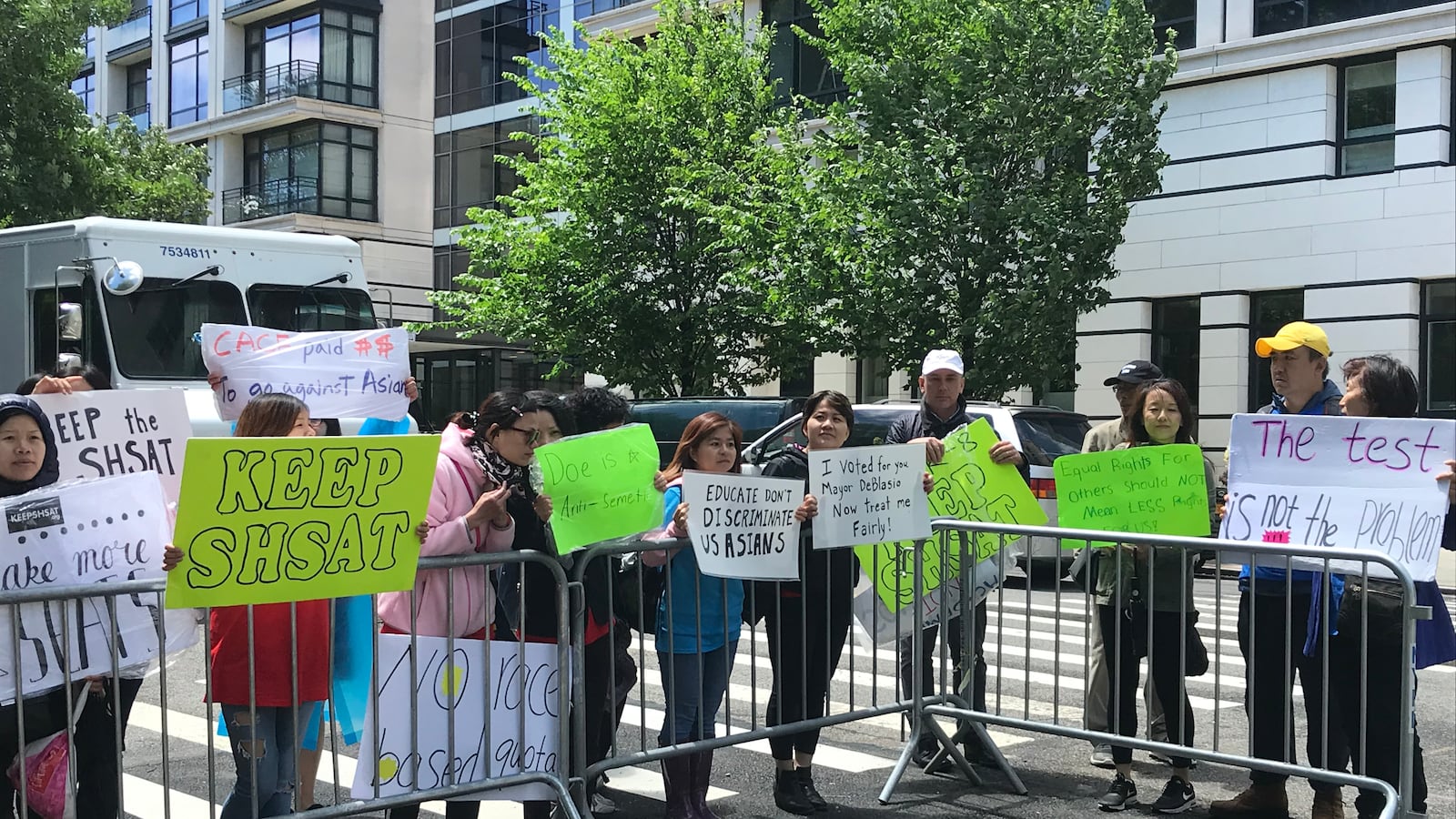 Parents and advocates rallied outside of Gracie Mansion while the mayor held a private meeting about the SHSAT with members of the Asian community.