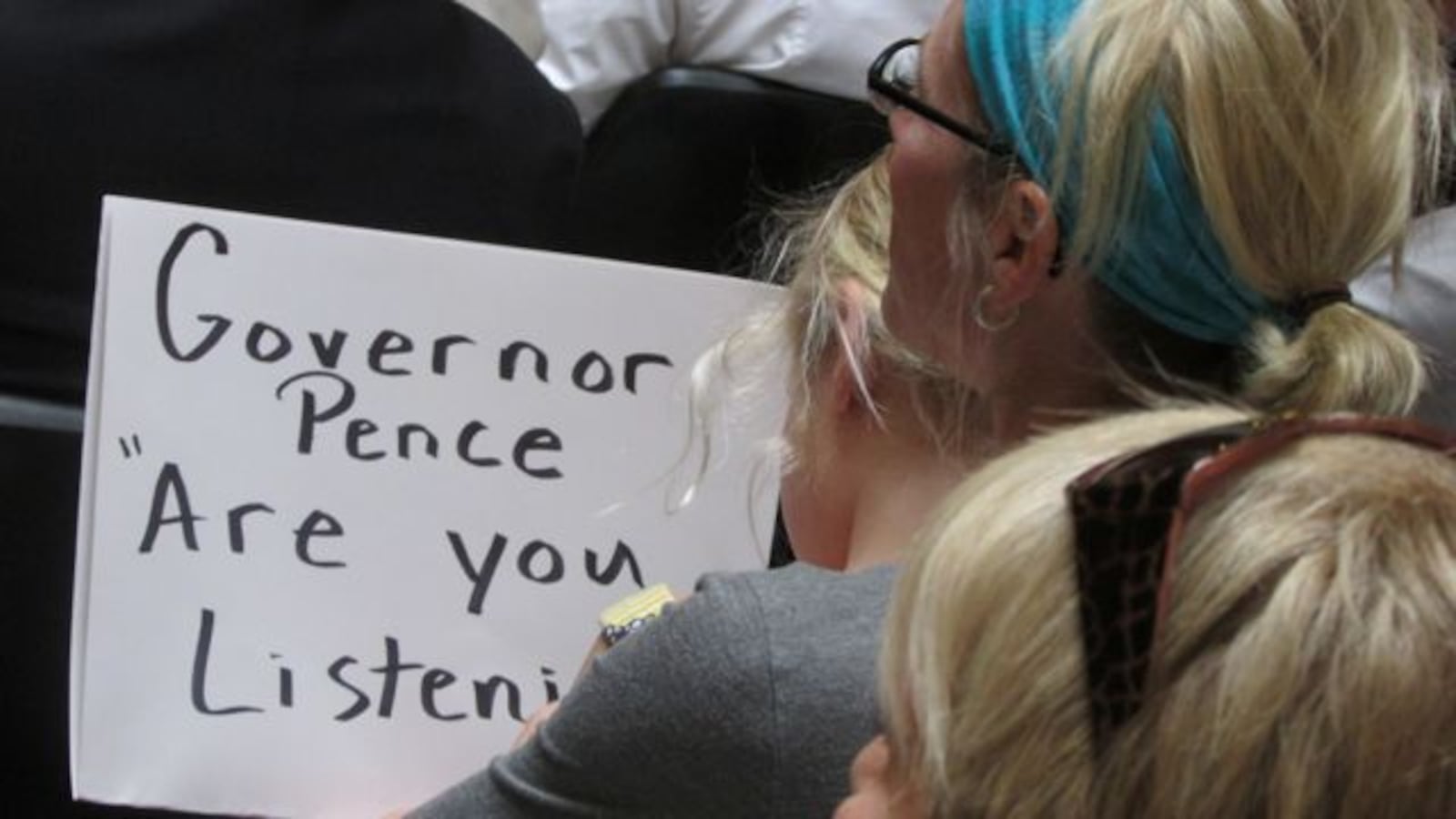 A statehouse rally before the Education Roundtable meeting against Indiana's proposed standards targeted Gov. Mike Pence, asking if he was listening to their concerns. (Scott Elliott)